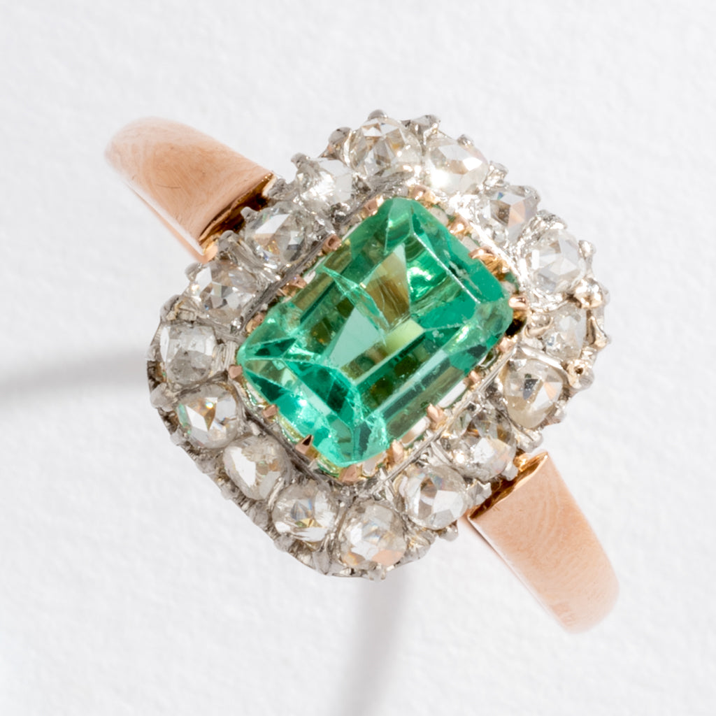 Emerald and diamond cluster ring.