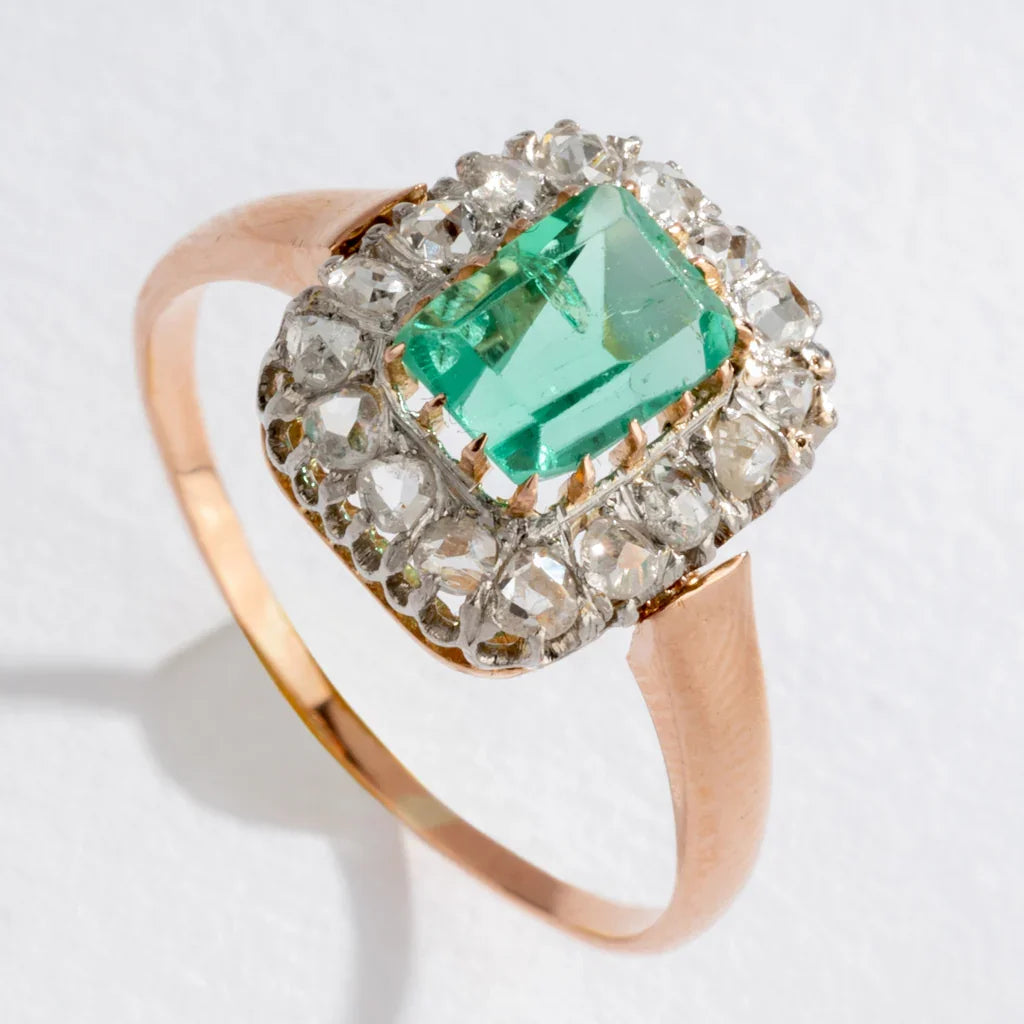 Emerald and diamond cluster ring.