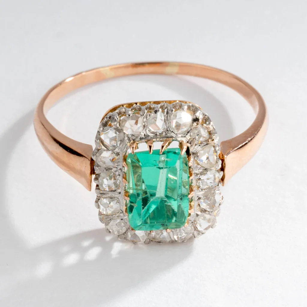 Emerald and diamond cluster ring.