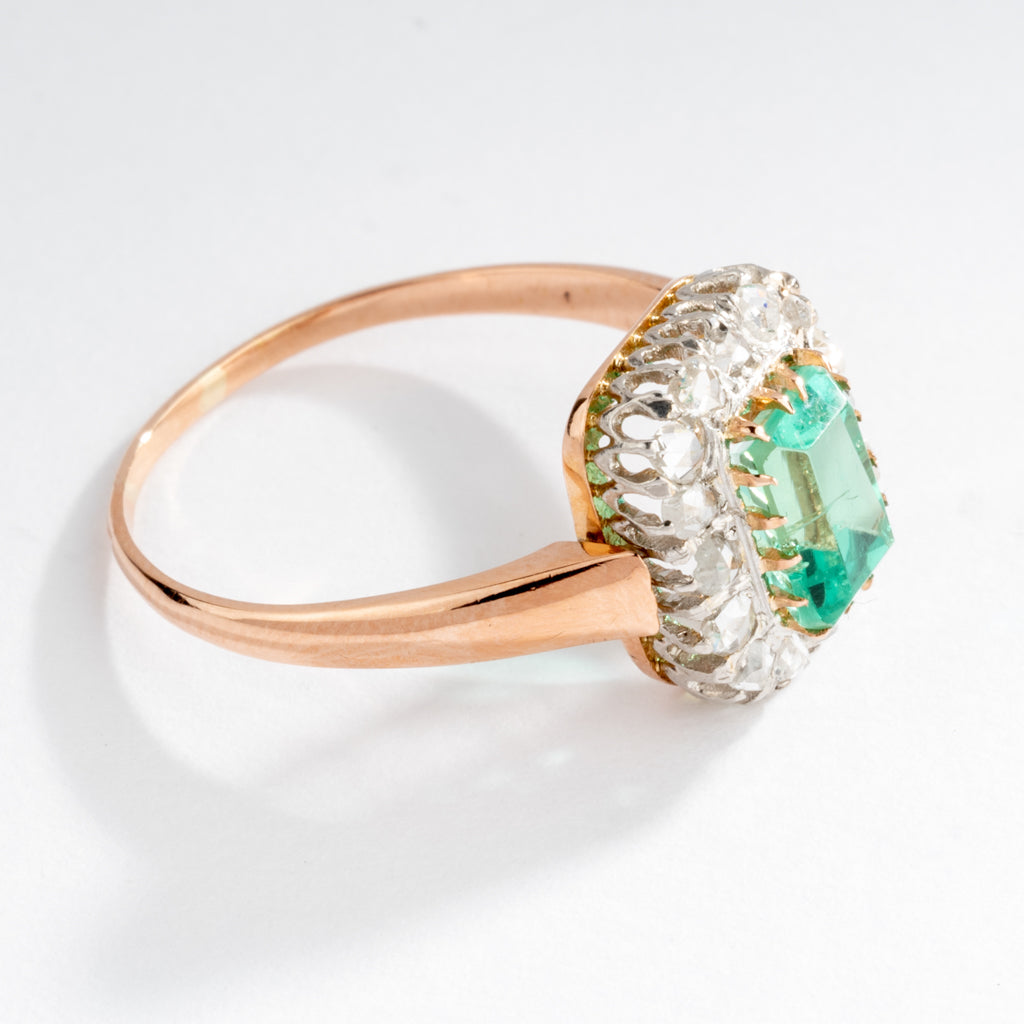 Emerald and diamond cluster ring.