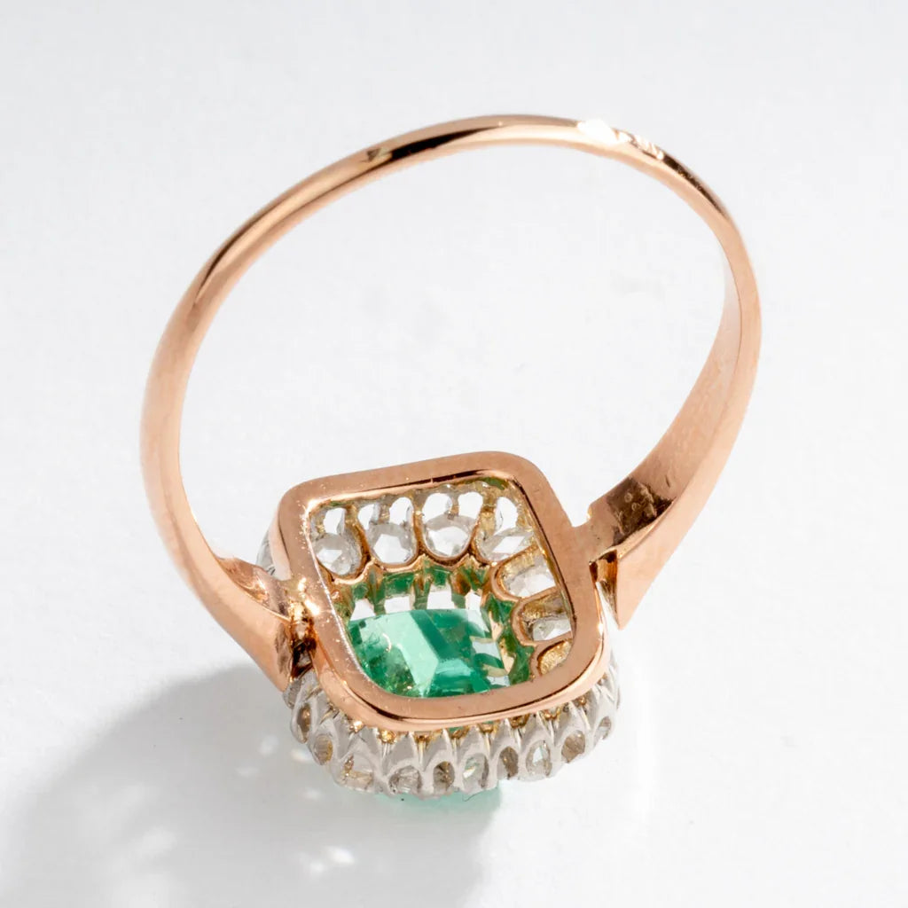 Emerald and diamond cluster ring.