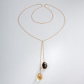 Yellow gold negligee necklace with fine gemstones