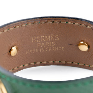 Bracelet de la maison Hermès en cuir et métal doré
