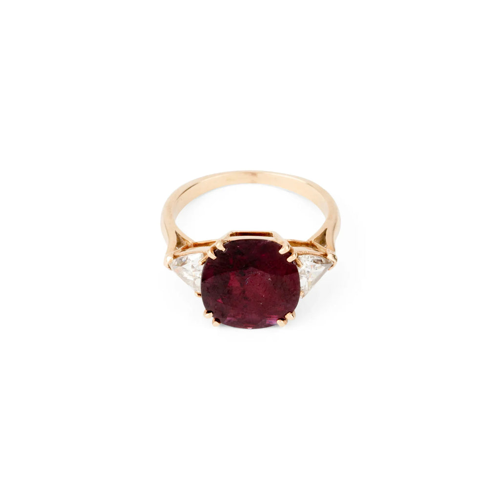 Oval ruby ring with two triangular diamonds