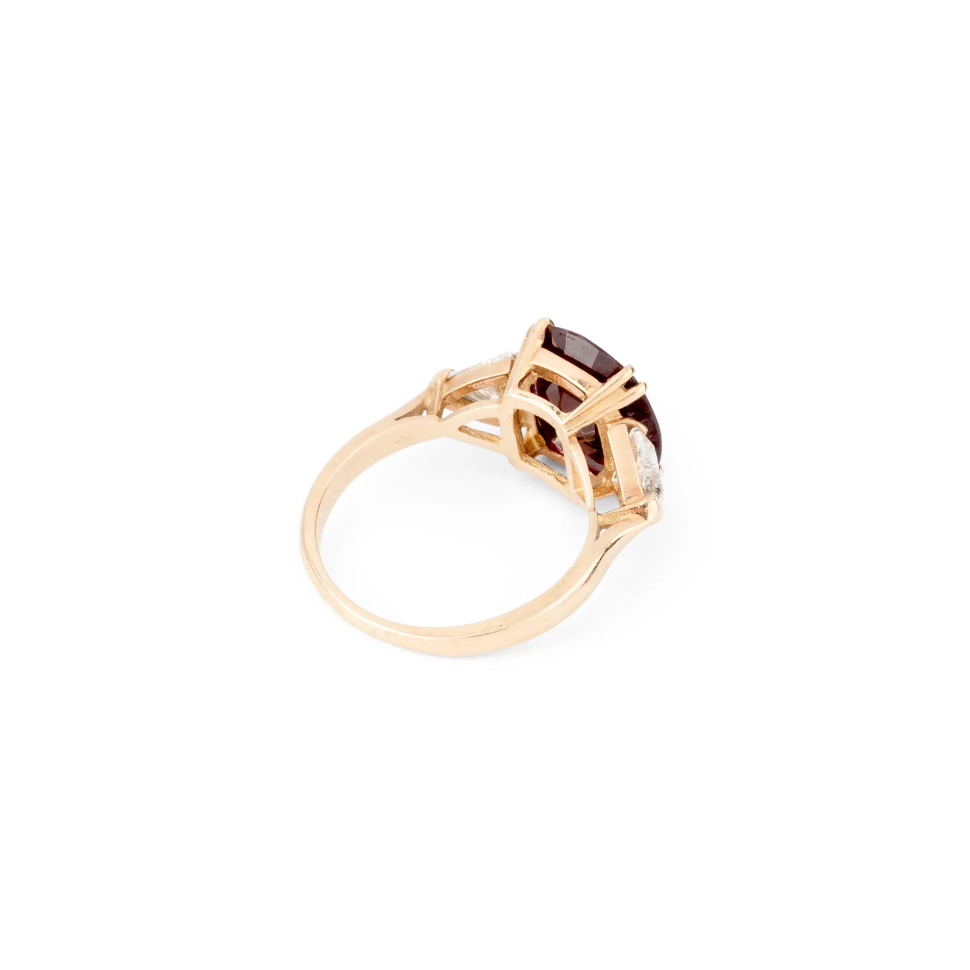 Oval ruby ring with two triangular diamonds