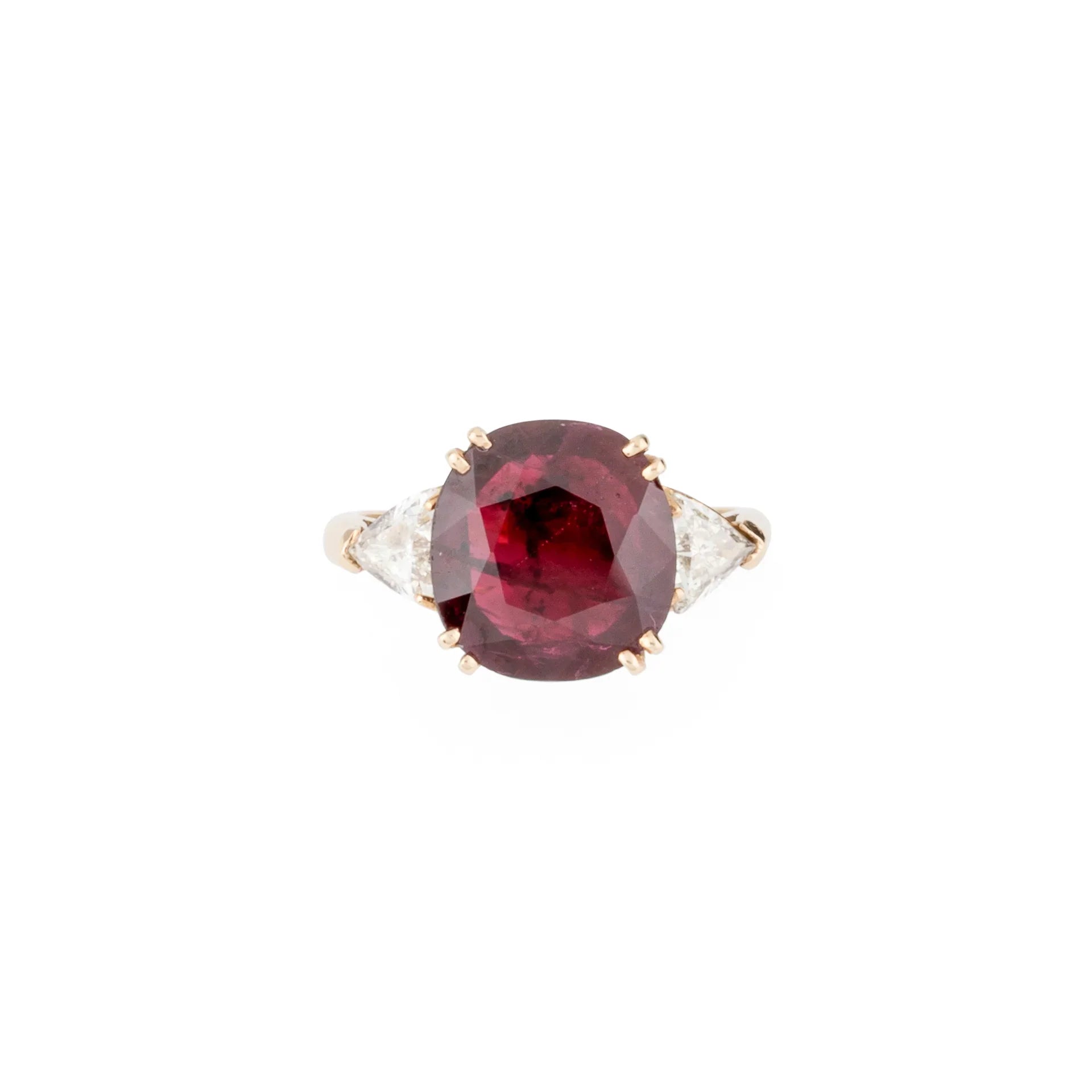 Oval ruby ring with two triangular diamonds