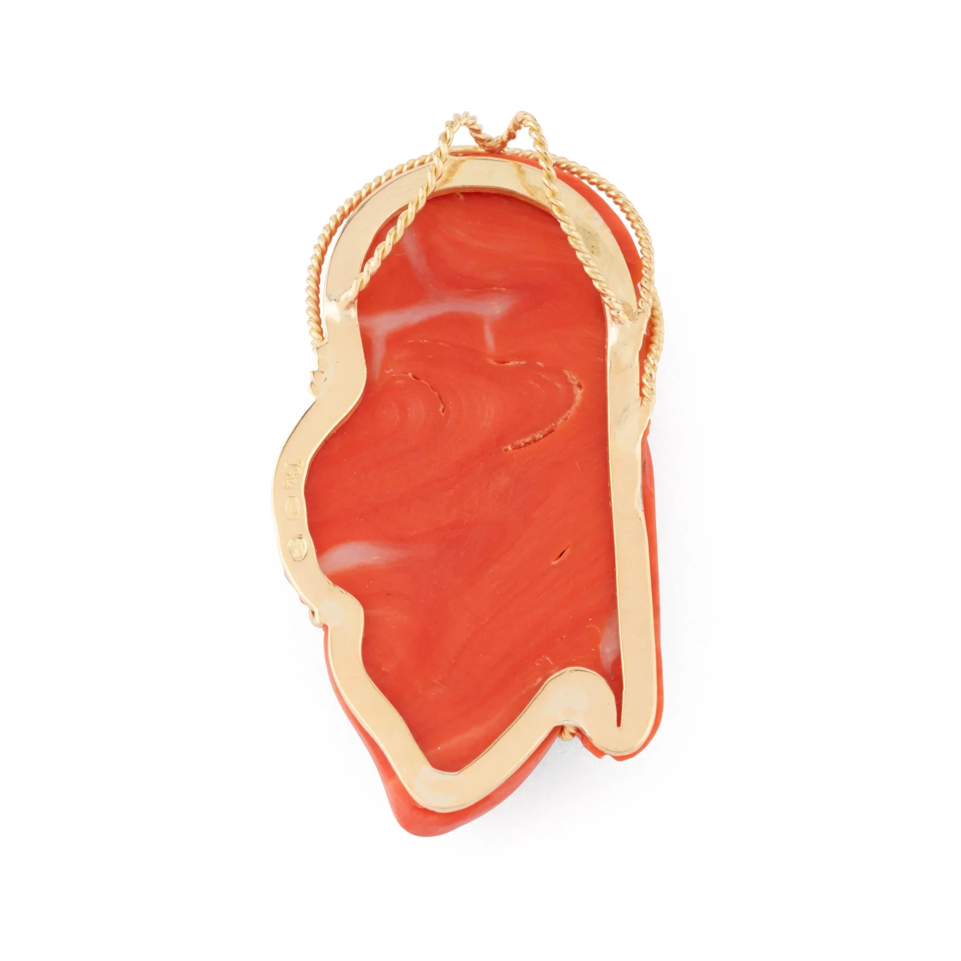 Pendentif en corail sur or jaune,représentant une tête de femme