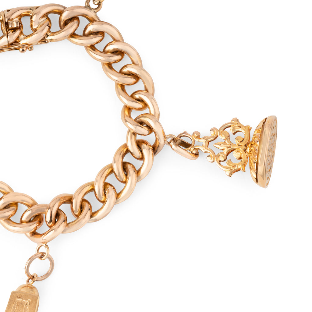 Bracelet or rose 18k,maillon gourmette orné de 4 breloques
