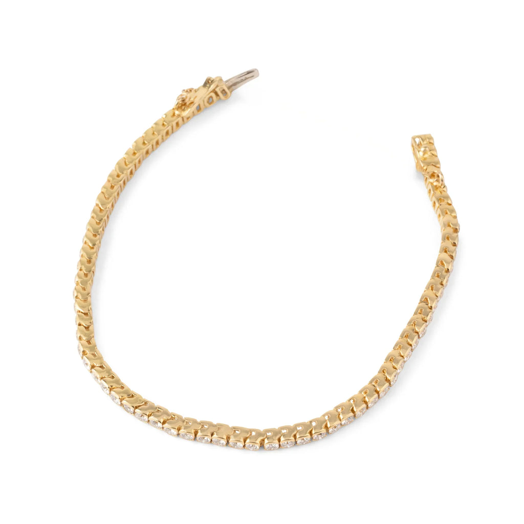Bracelet riviere en diamant, sur or jaune en serti semi-clos