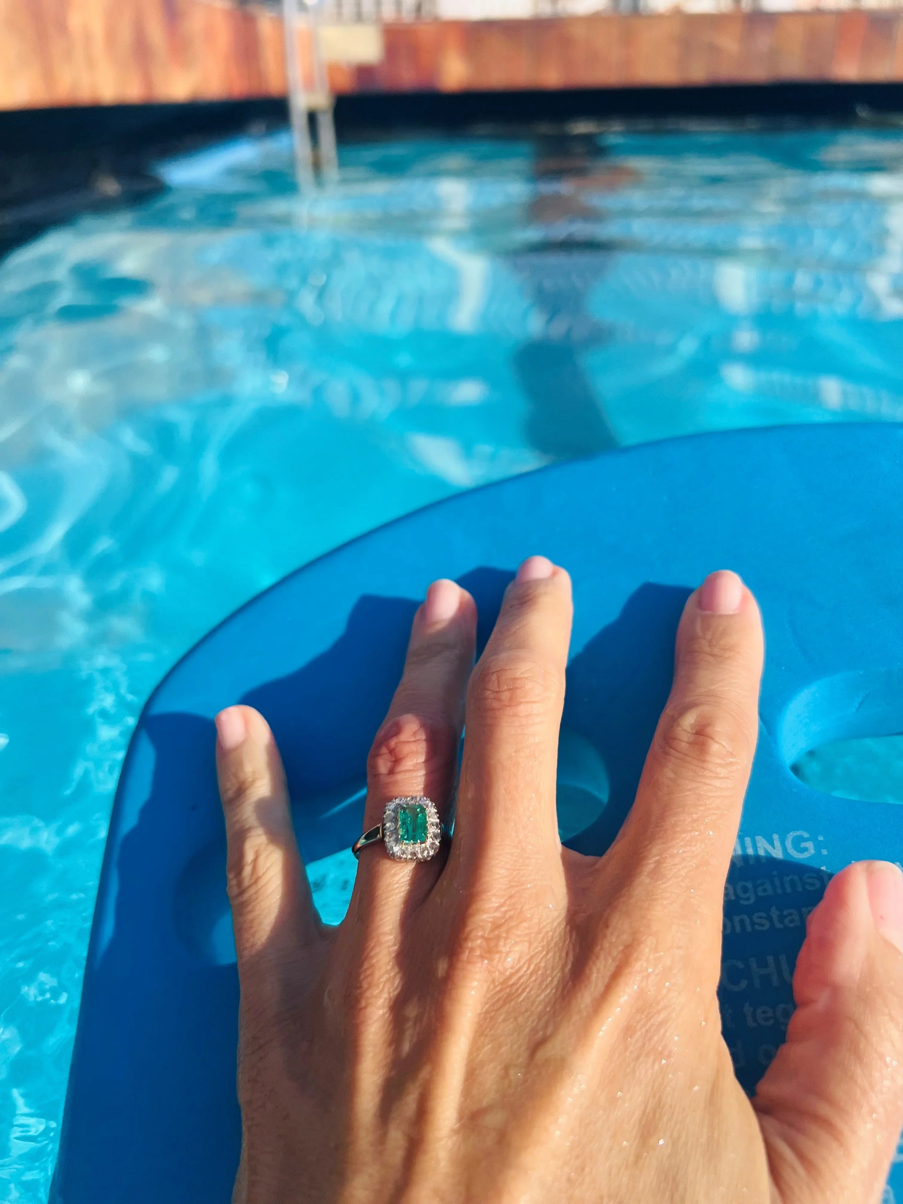 Emerald and diamond cluster ring.