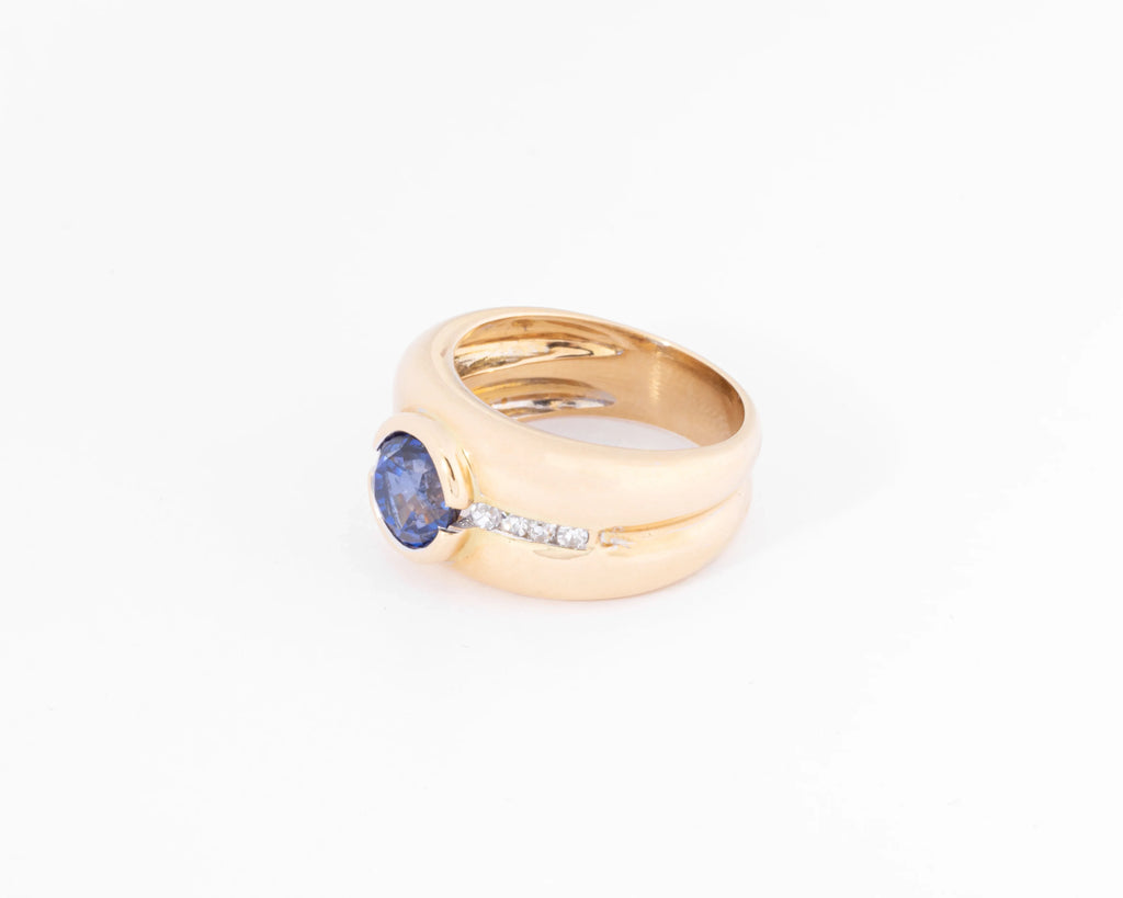 Yellow gold hoop ring adorned with a round-cut sapphire and diamond