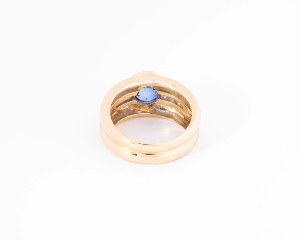 Yellow gold hoop ring adorned with a round-cut sapphire and diamond