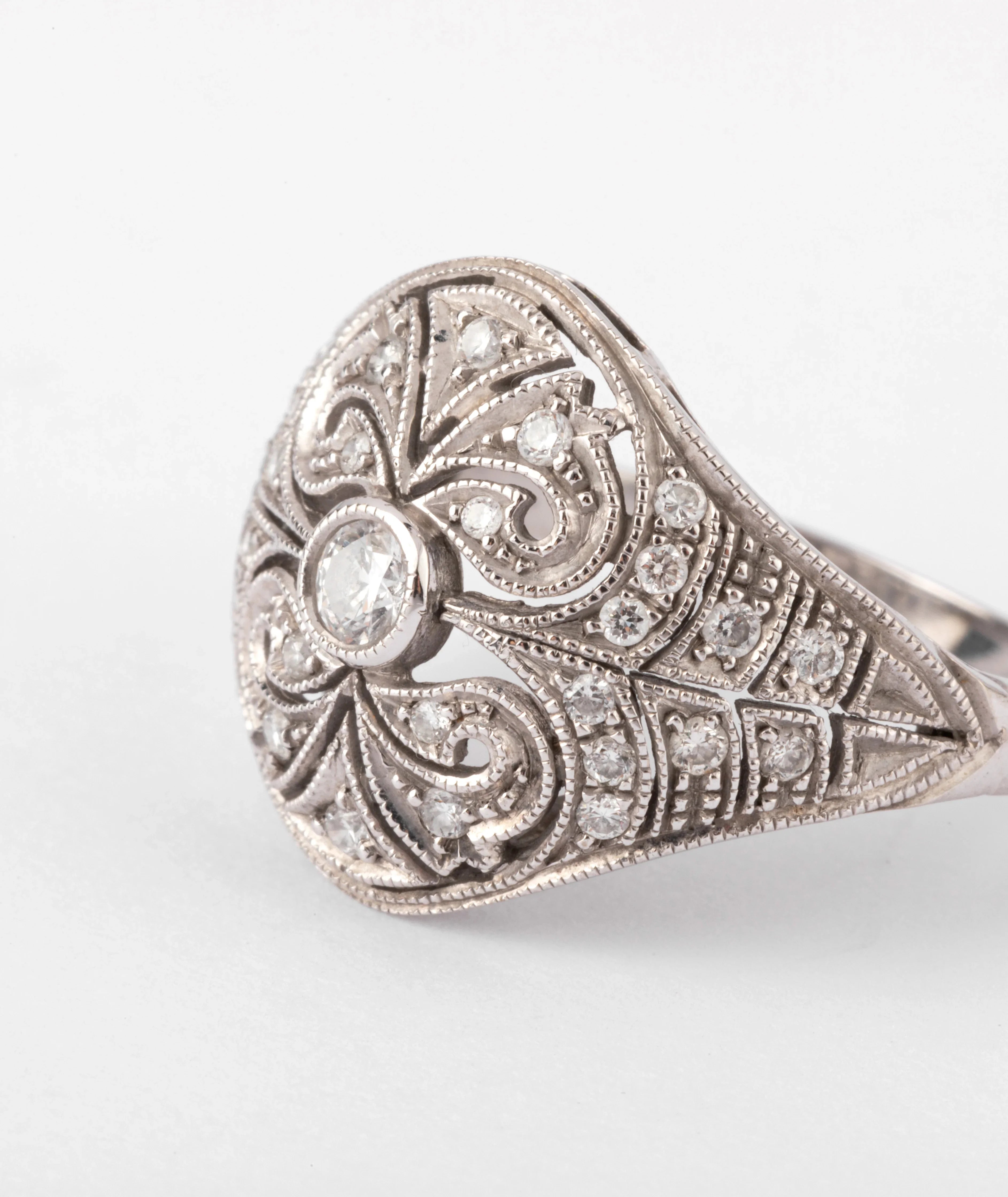 Carved gray gold and diamond dome ring