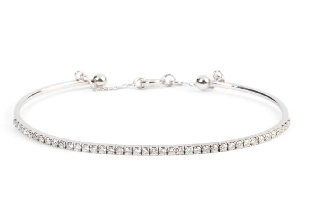 Half-bangle bracelet in white gold with diamond on top