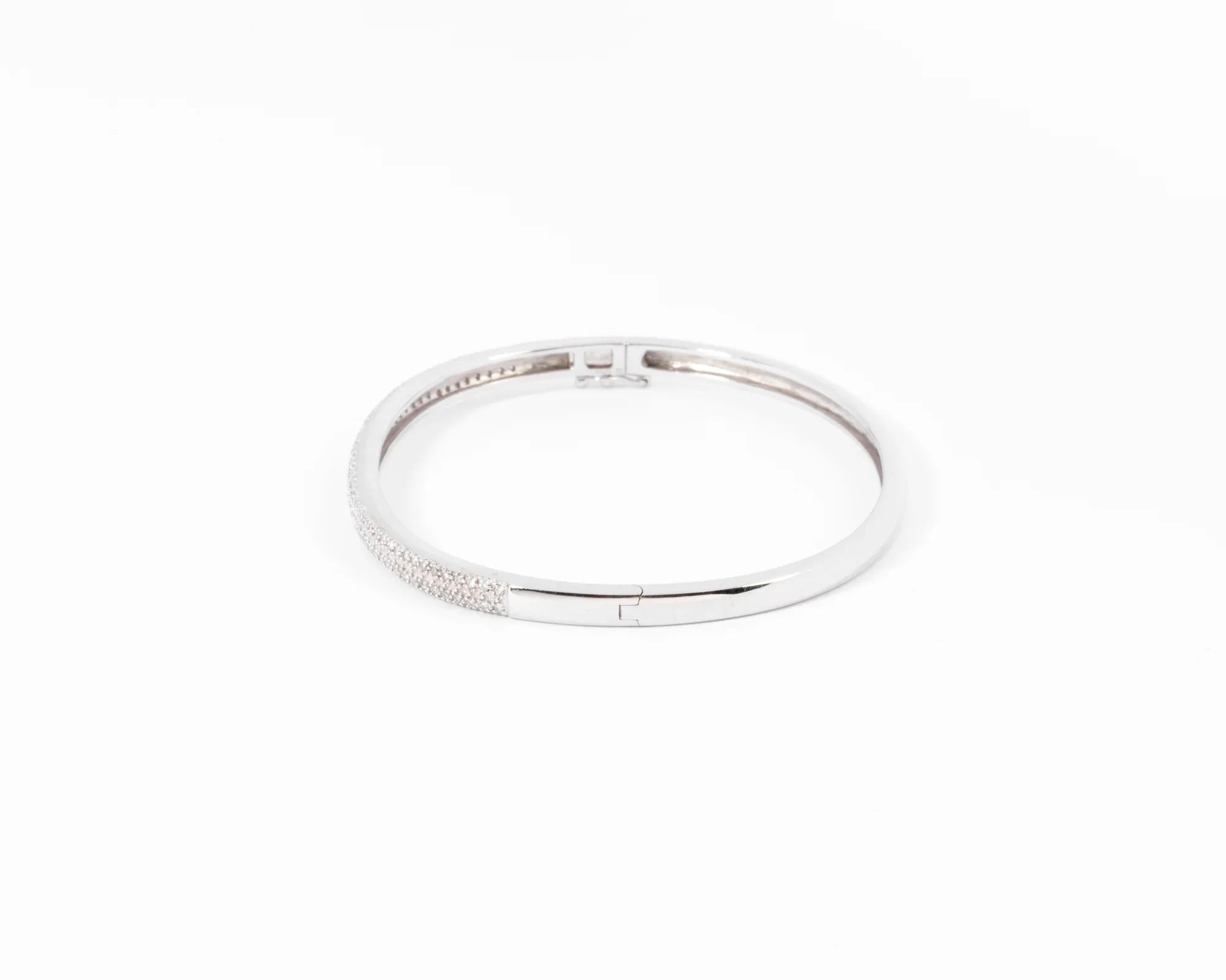 Rigid white gold diamond-set hinged bracelet