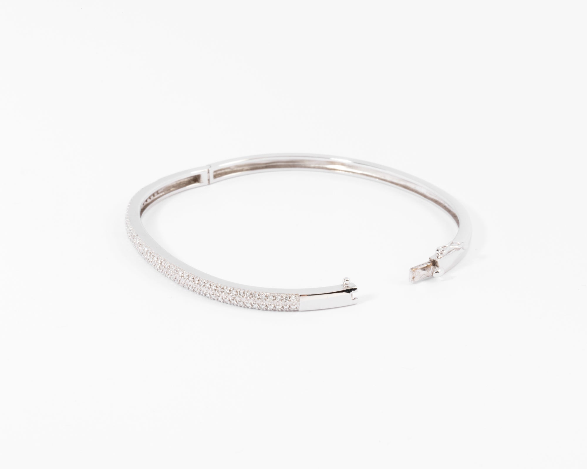 Rigid white gold diamond-set hinged bracelet