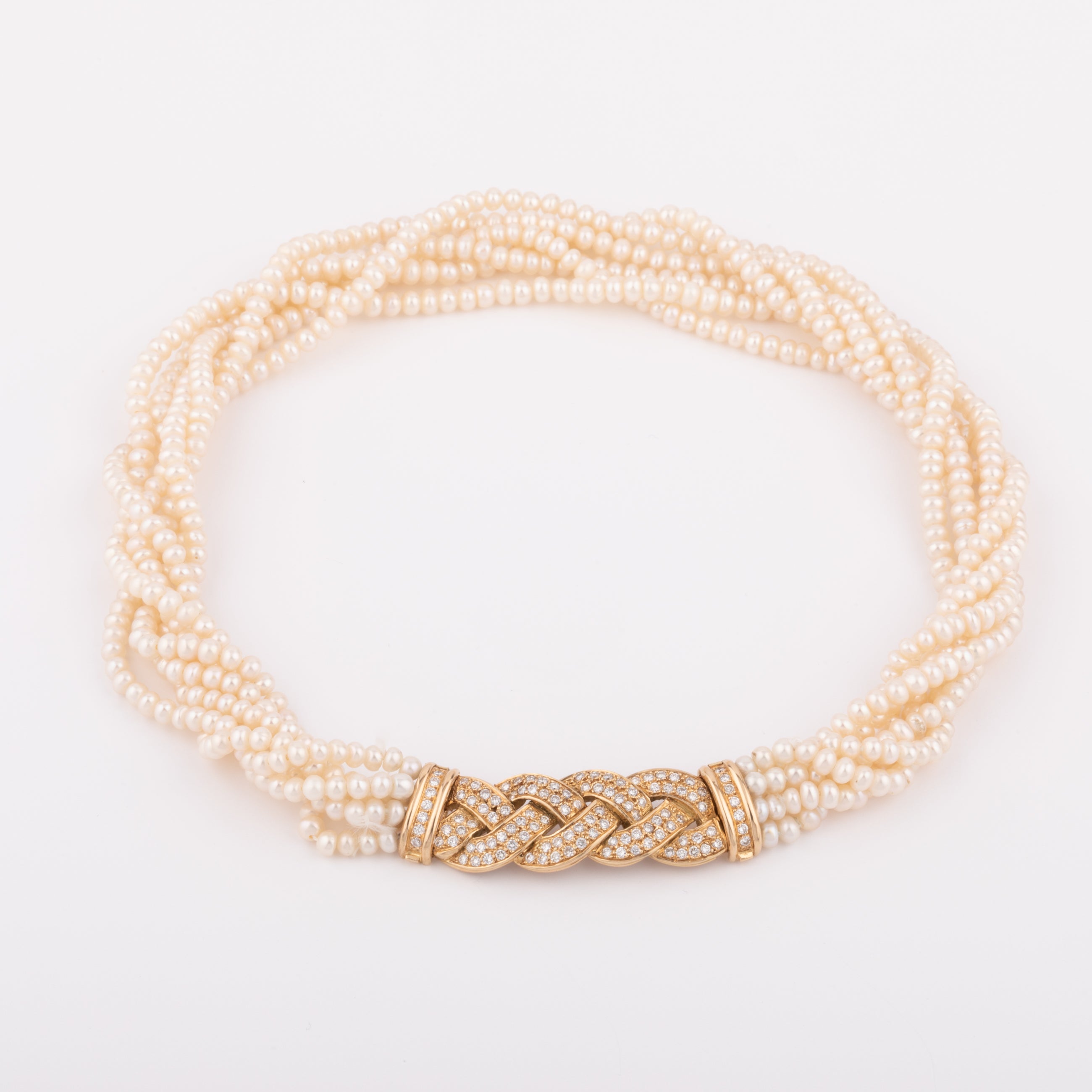 Multi-strand pearl necklace with diamond clasp