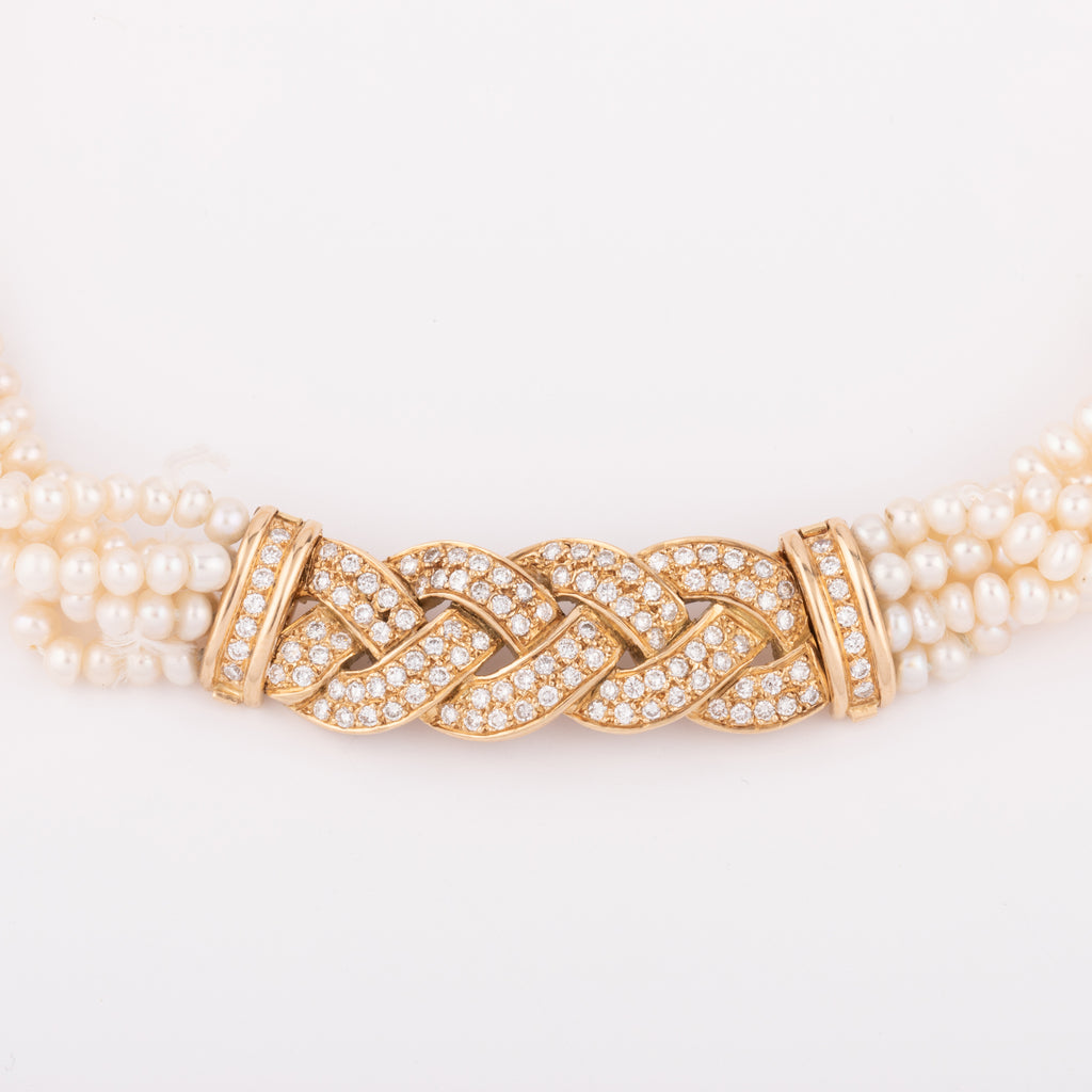 Multi-strand pearl necklace with diamond clasp