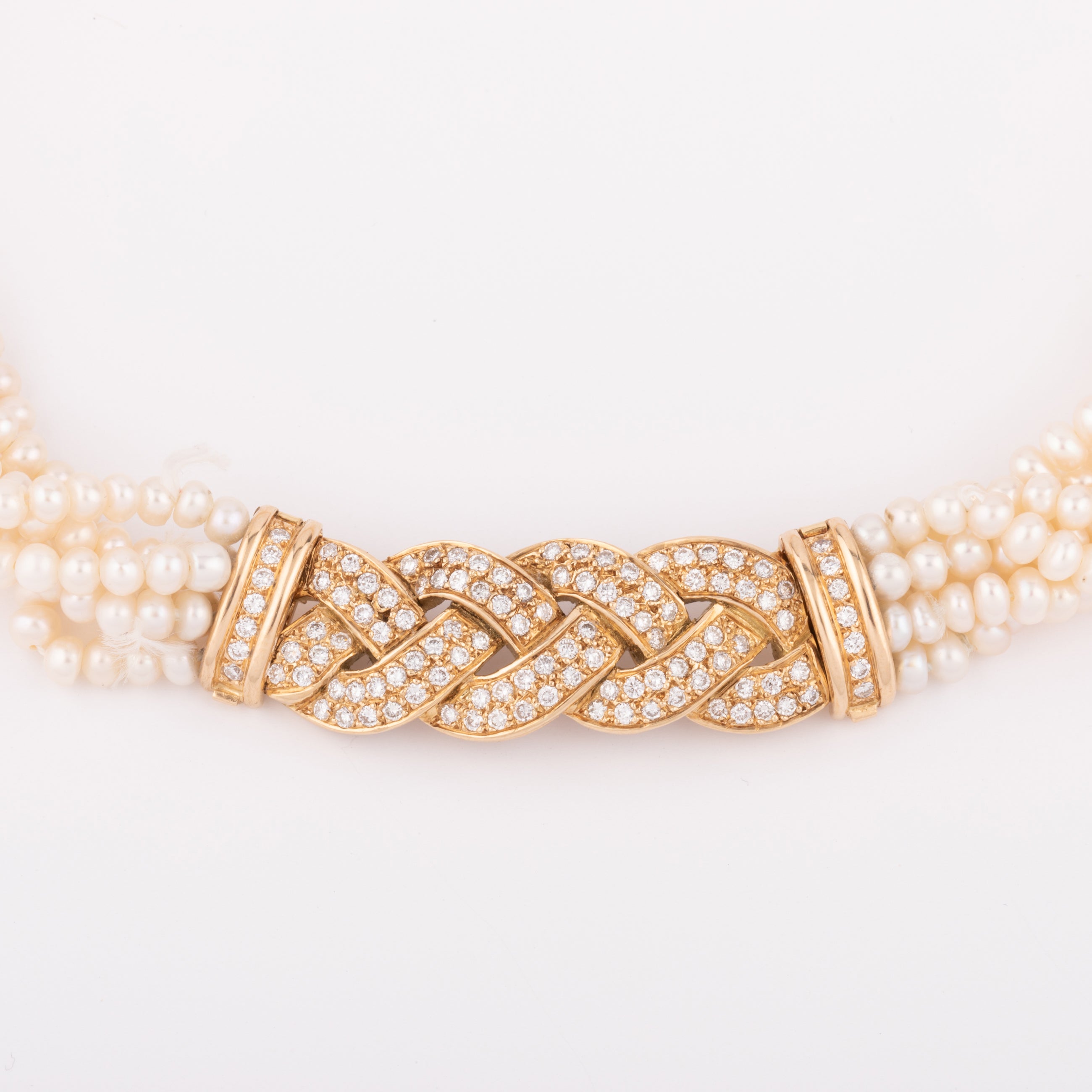 Multi-strand pearl necklace with diamond clasp