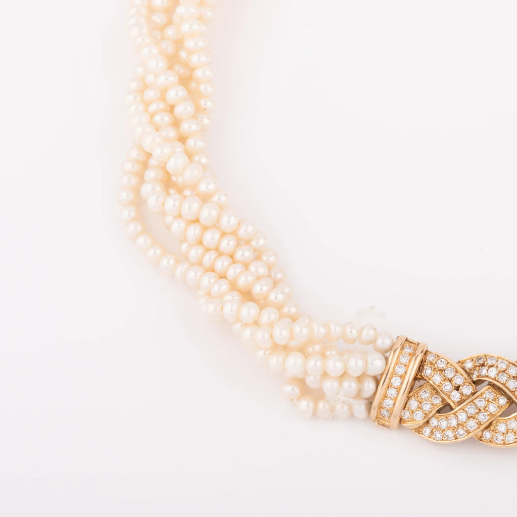 Multi-strand pearl necklace with diamond clasp