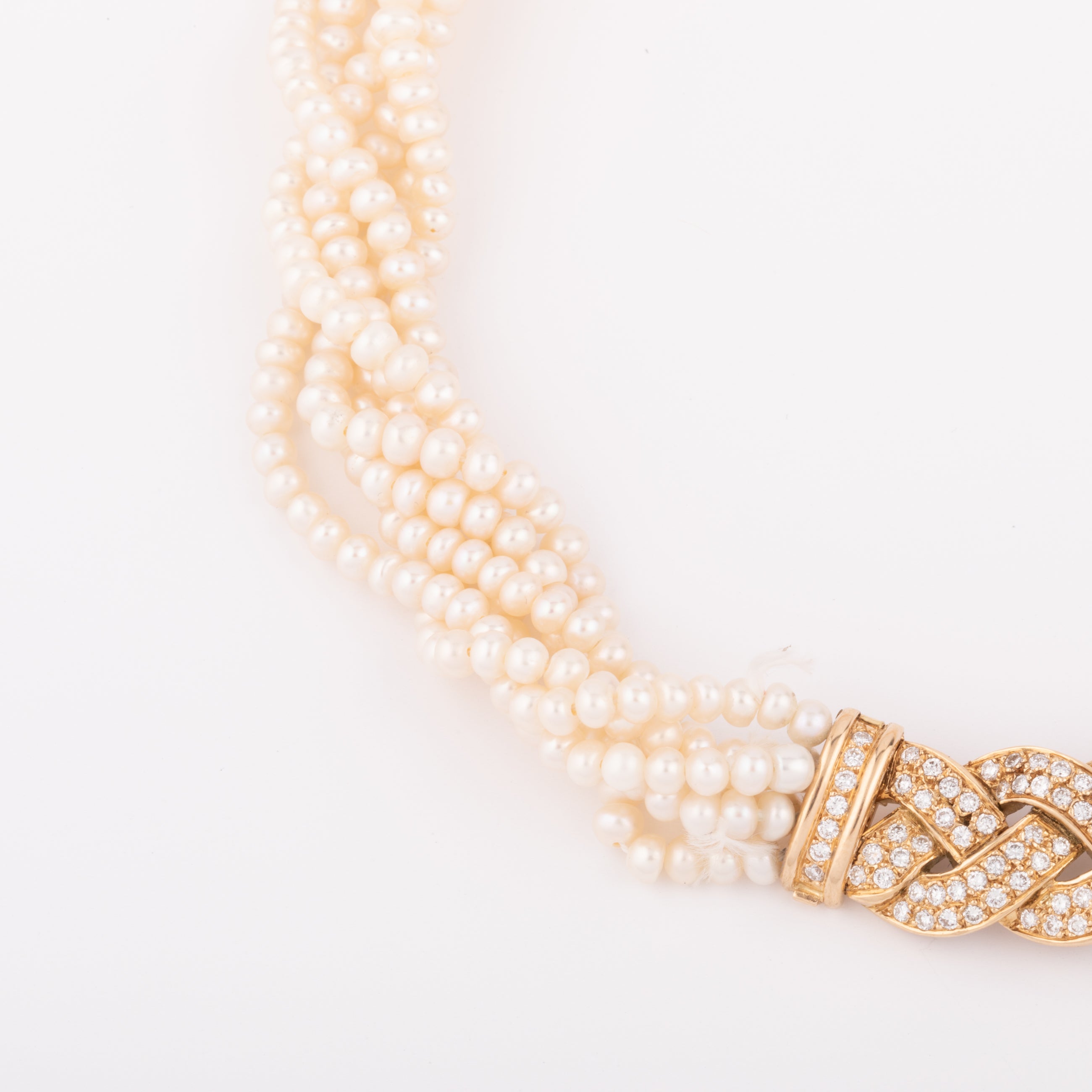 Multi-strand pearl necklace with diamond clasp