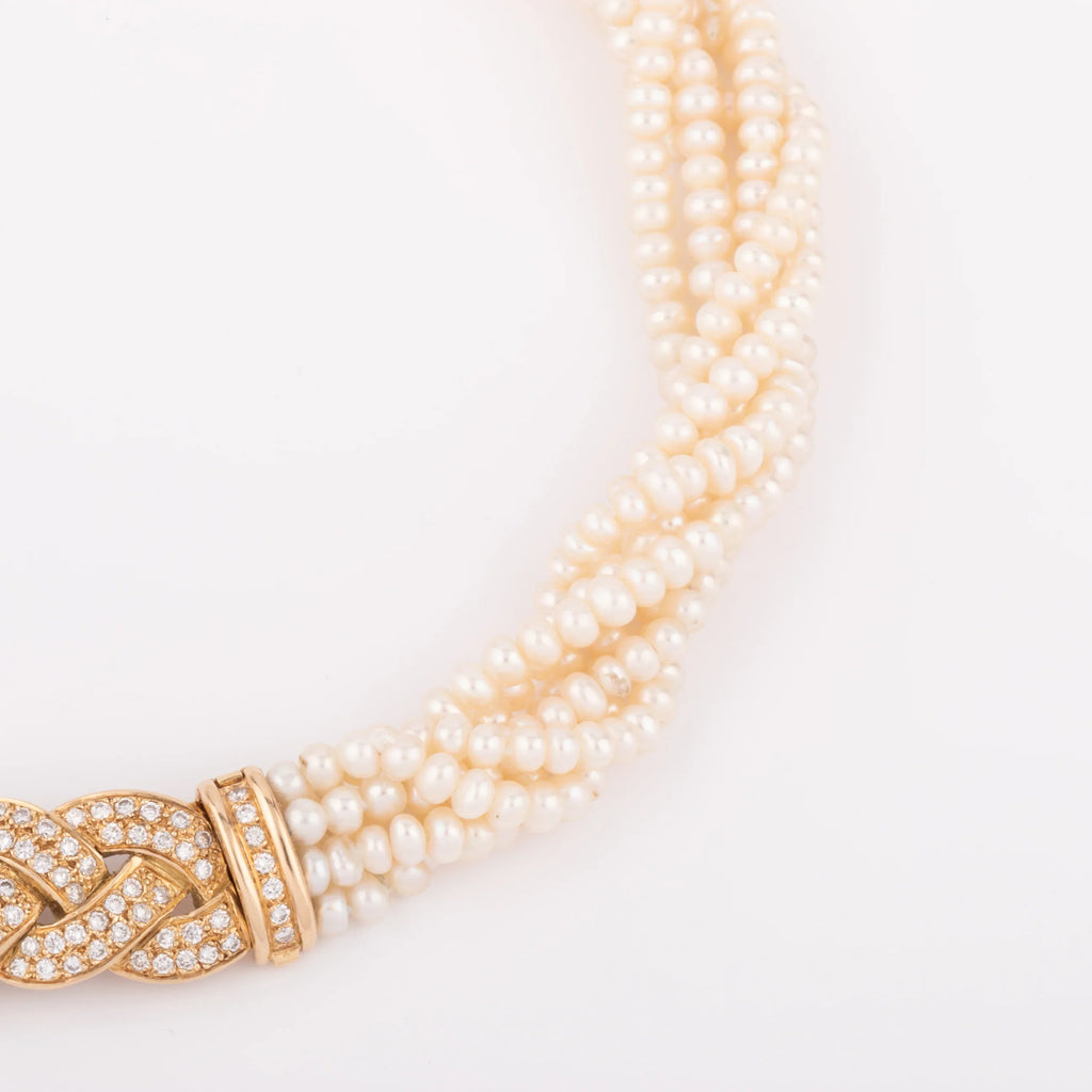 Multi-strand pearl necklace with diamond clasp