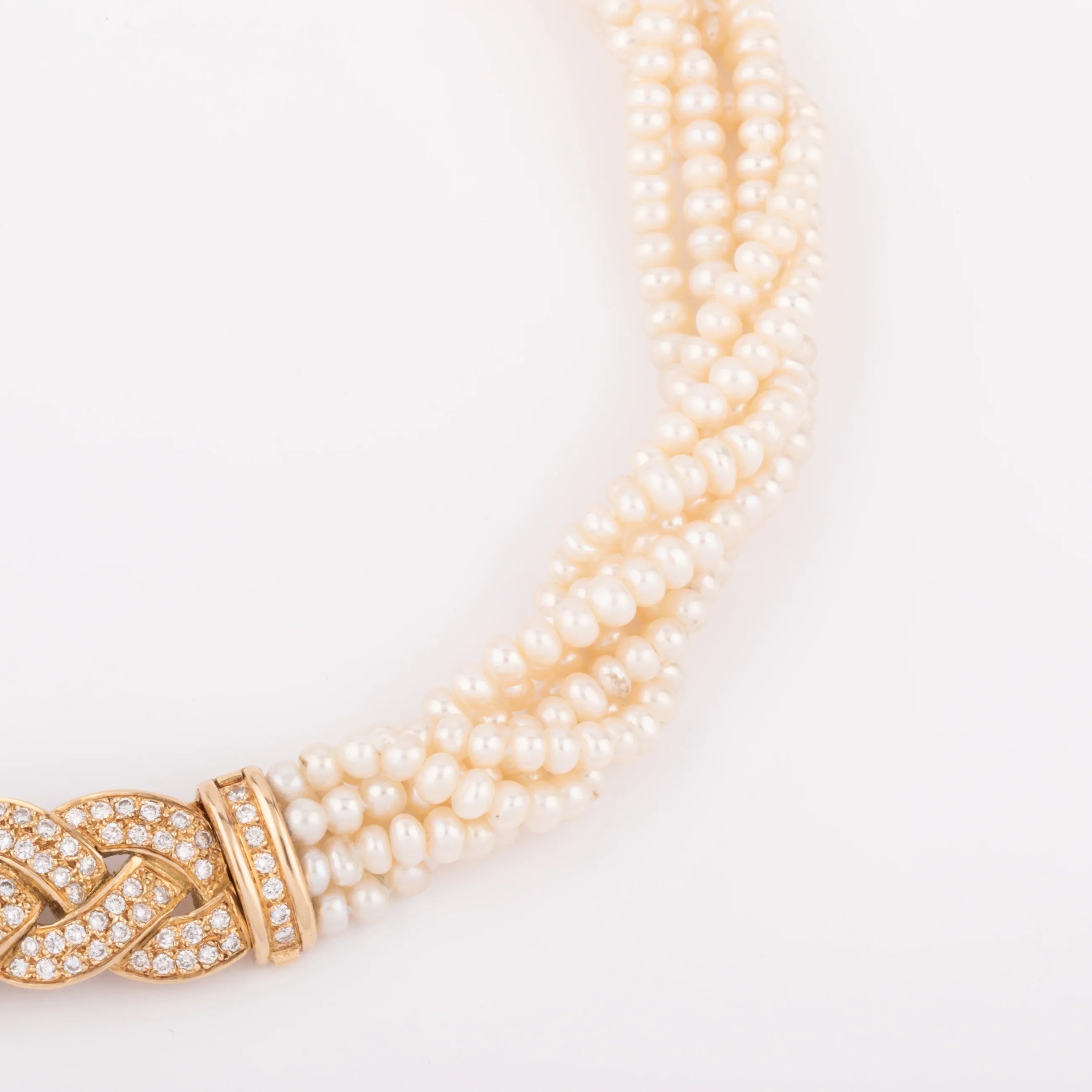 Multi-strand pearl necklace with diamond clasp
