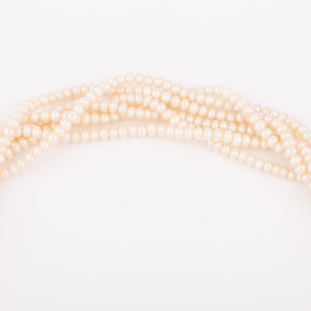 Multi-strand pearl necklace with diamond clasp