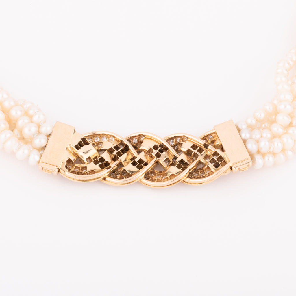Multi-strand pearl necklace with diamond clasp