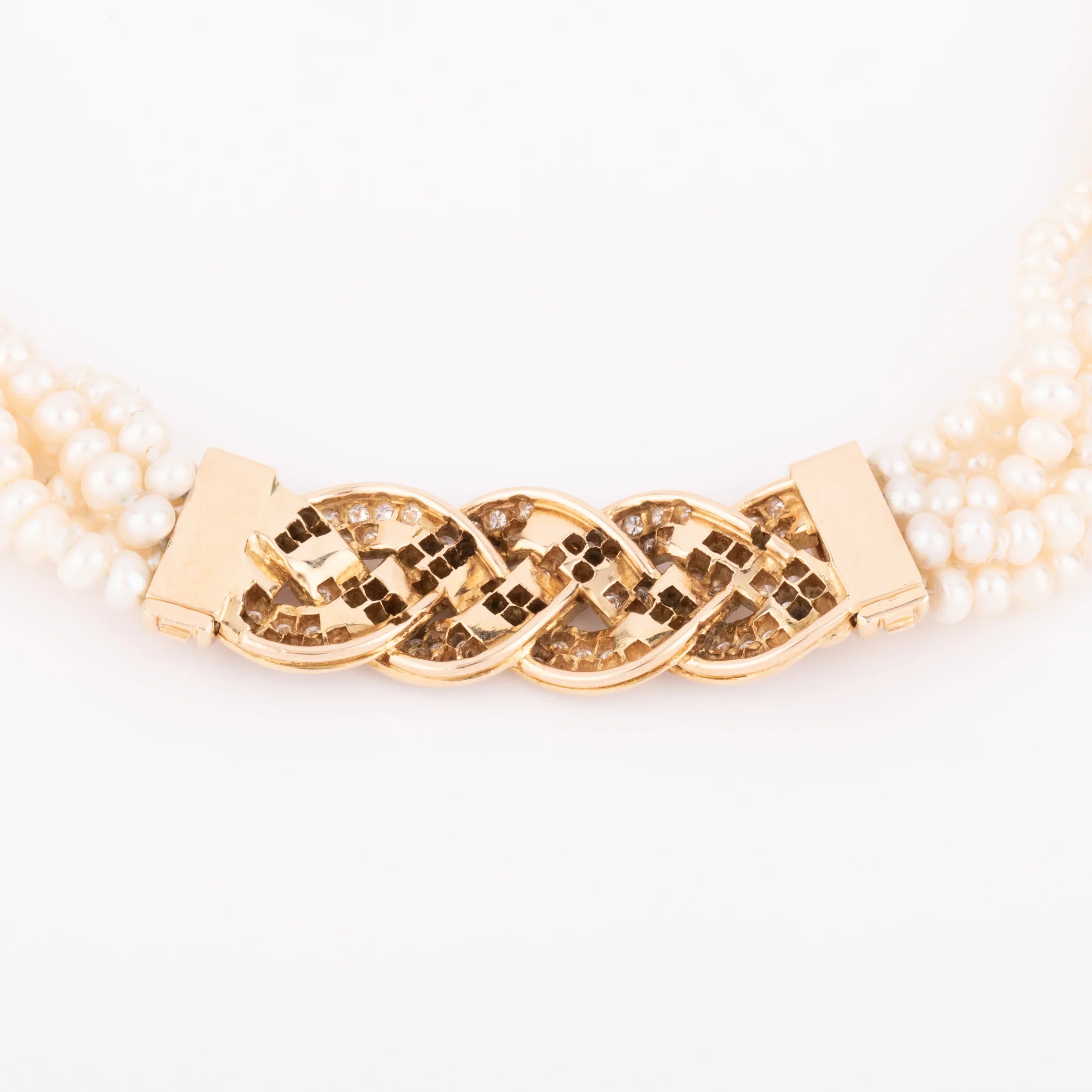 Multi-strand pearl necklace with diamond clasp
