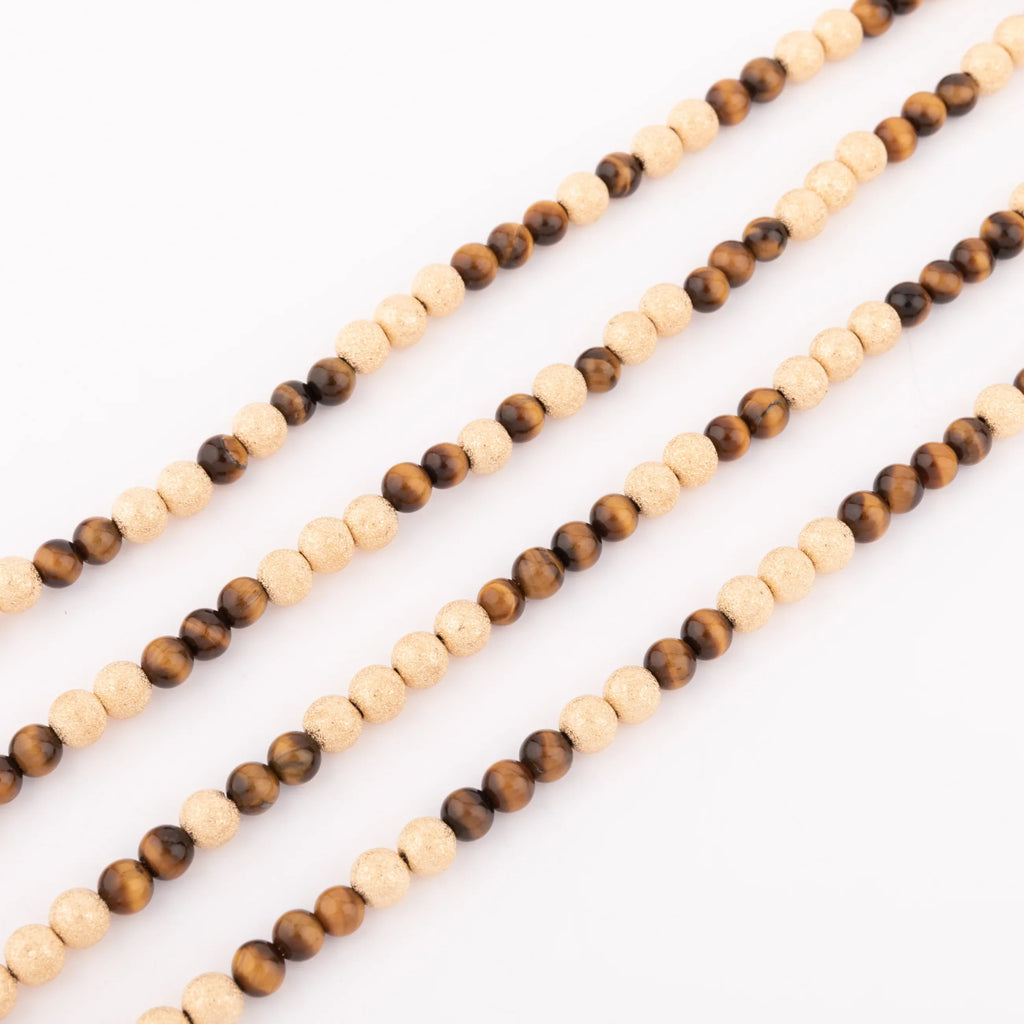 Sautoir necklace in sandblasted yellow gold and tiger's eye pearl