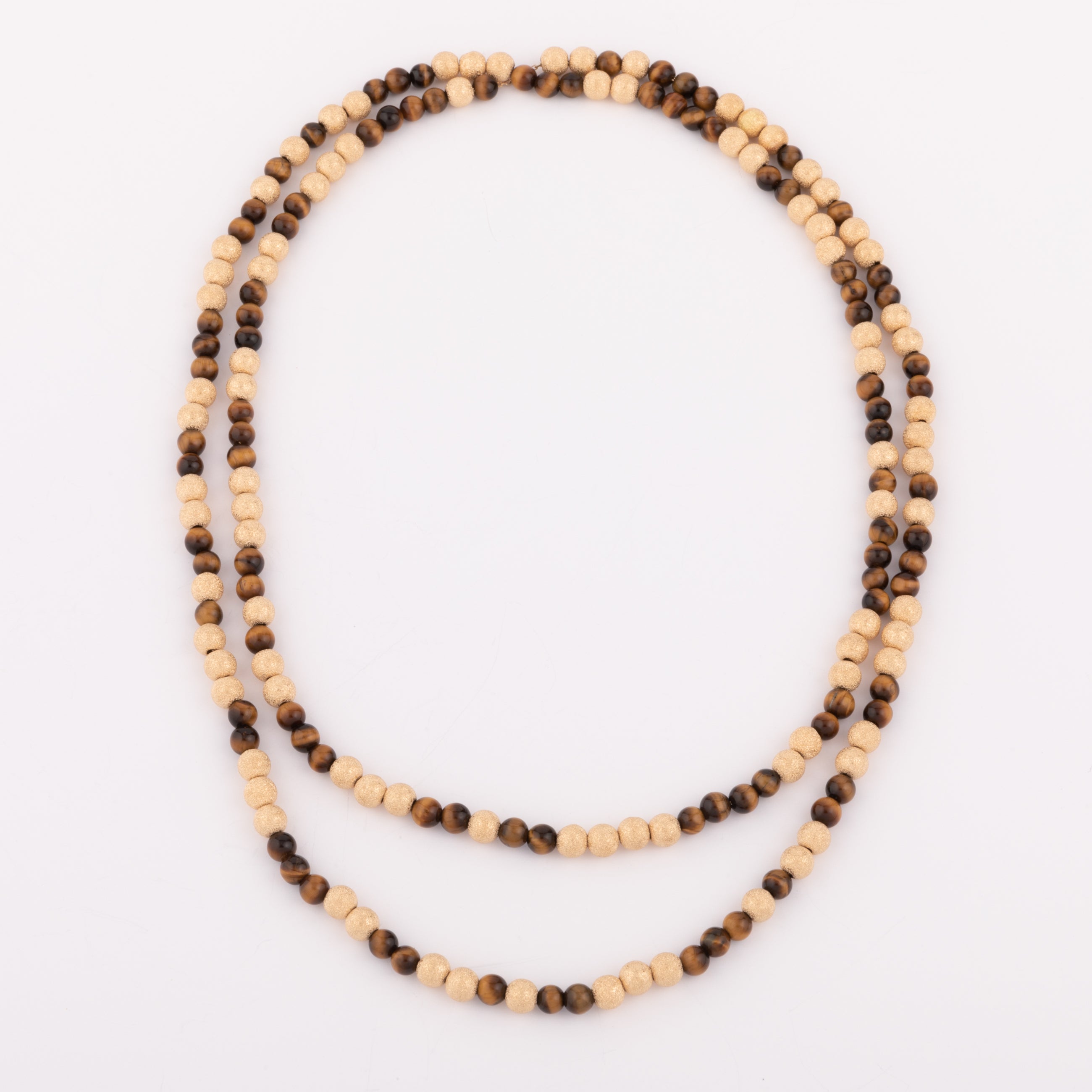 Sautoir necklace in sandblasted yellow gold and tiger's eye pearl