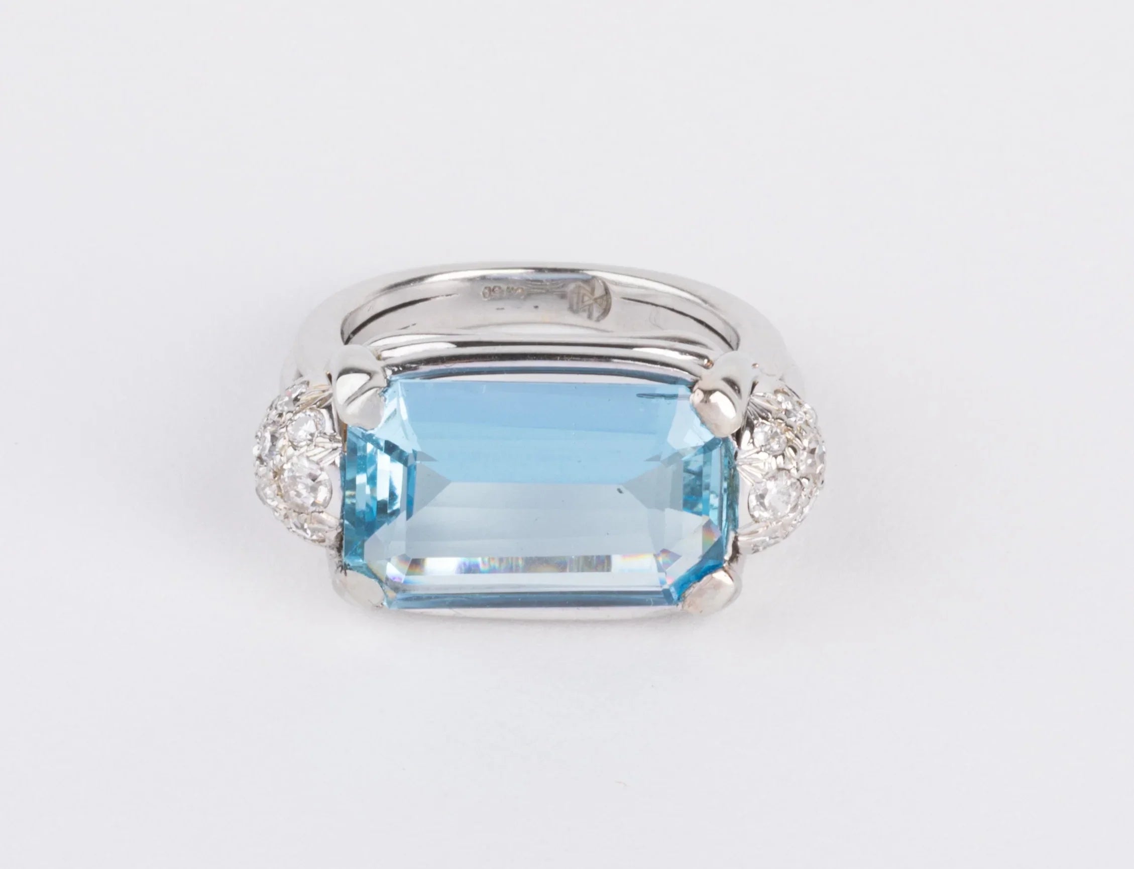 White gold ring set with an aquamarine and diamonds