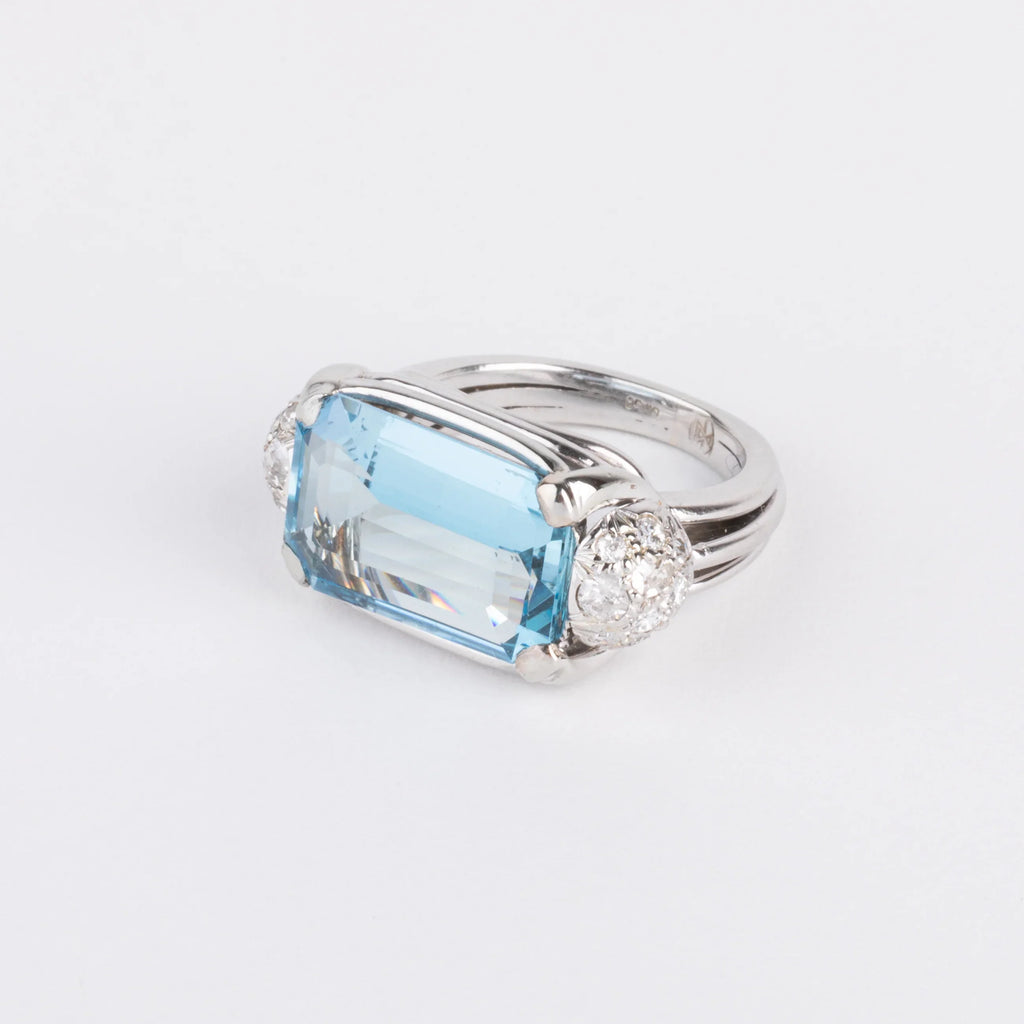 White gold ring set with an aquamarine and diamonds
