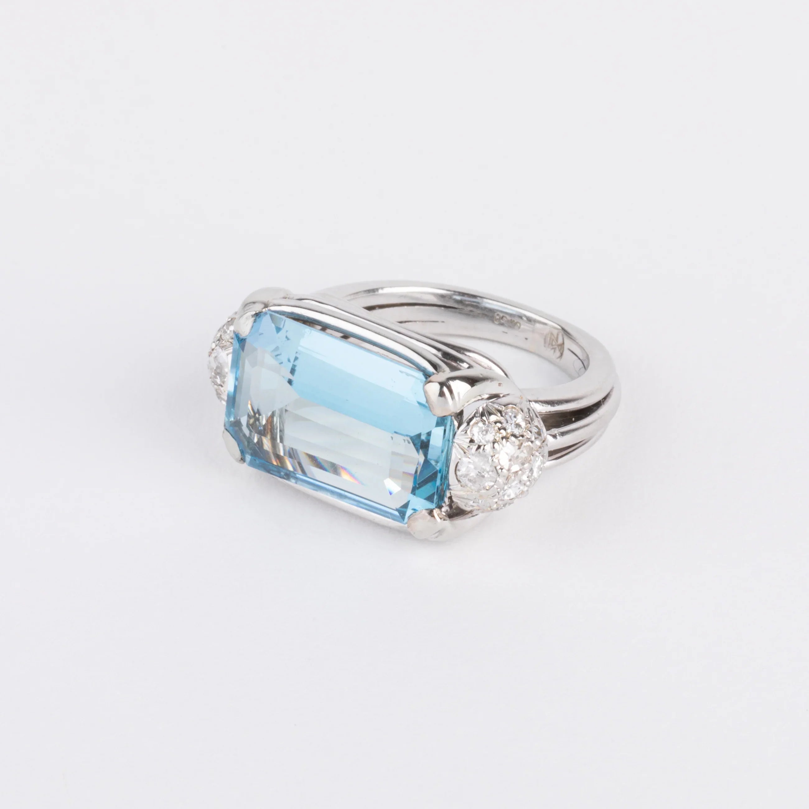 White gold ring set with an aquamarine and diamonds