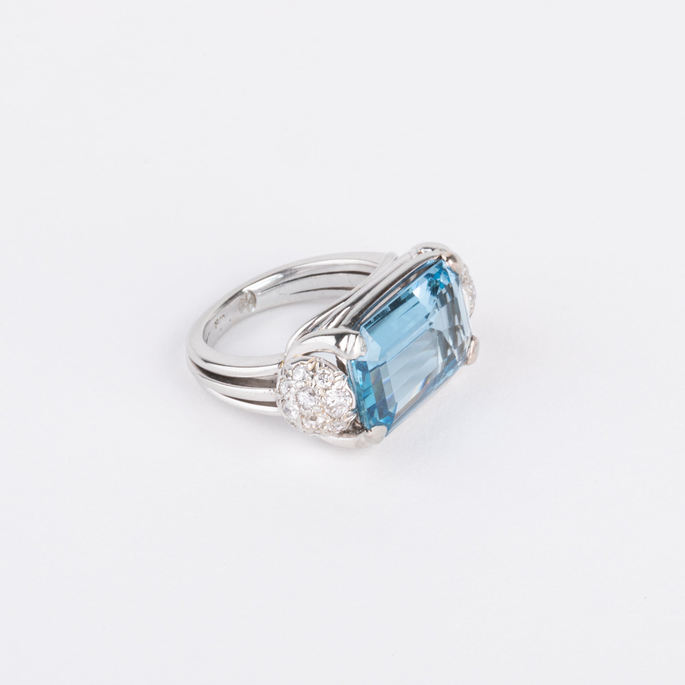 White gold ring set with an aquamarine and diamonds