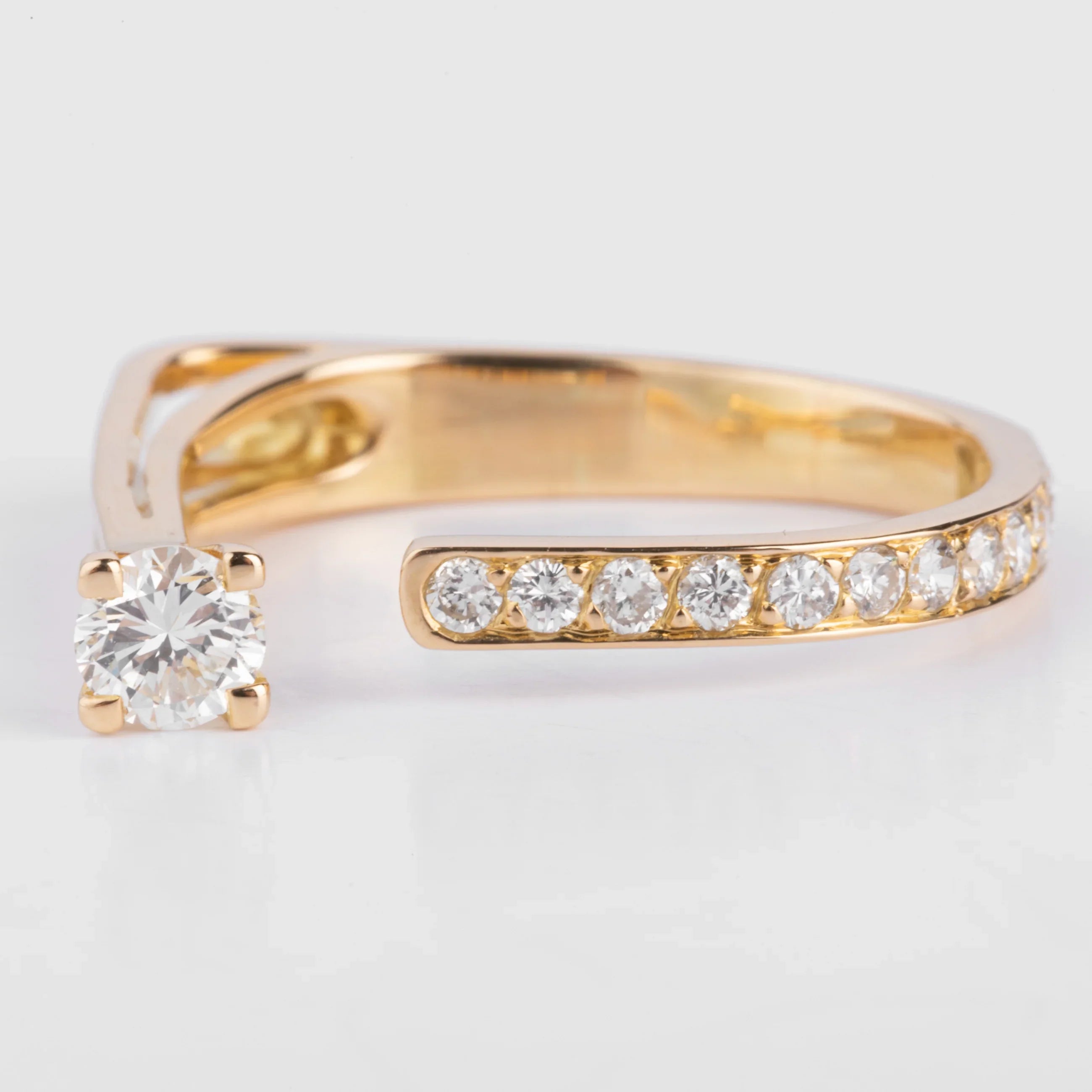 Open yellow gold and diamond design ring