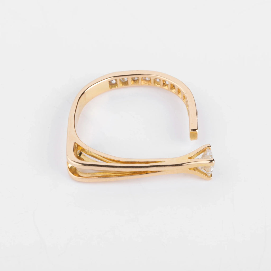 Open yellow gold and diamond design ring