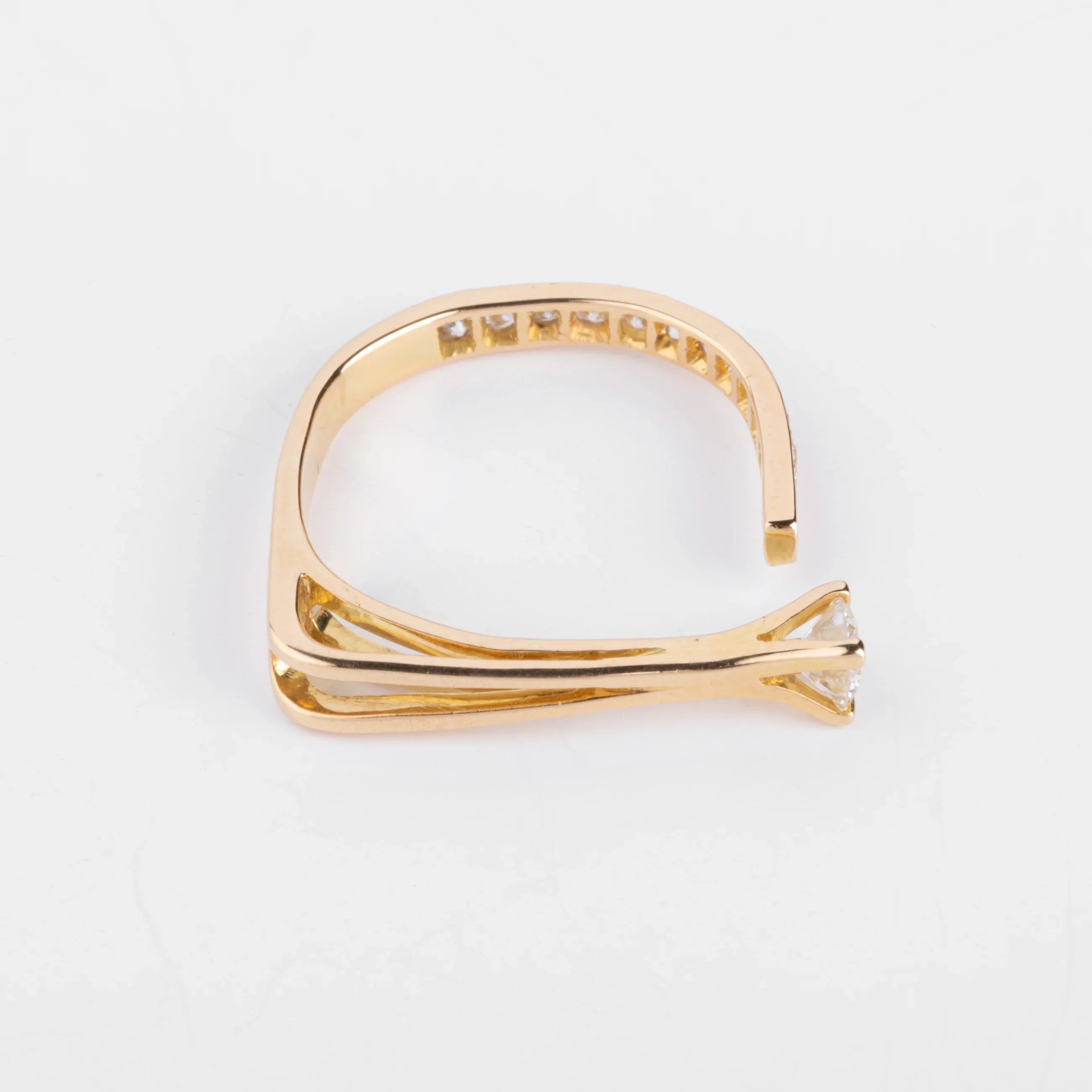 Open yellow gold and diamond design ring