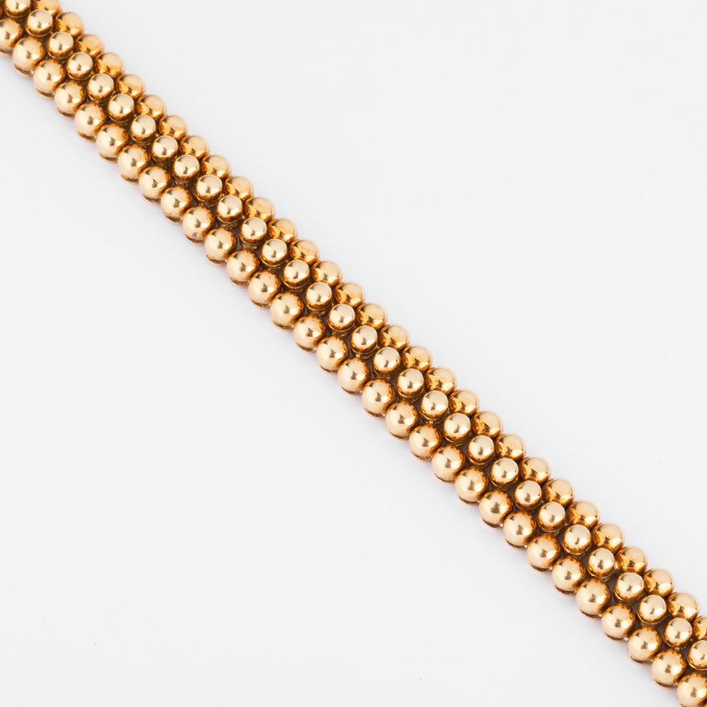 Bracelet or jaune 18k signé et numéroté de la maison Boucheron collection Grains de Raisin