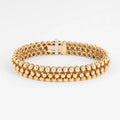 Bracelet or jaune 18k signé et numéroté de la maison Boucheron collection Grains de Raisin