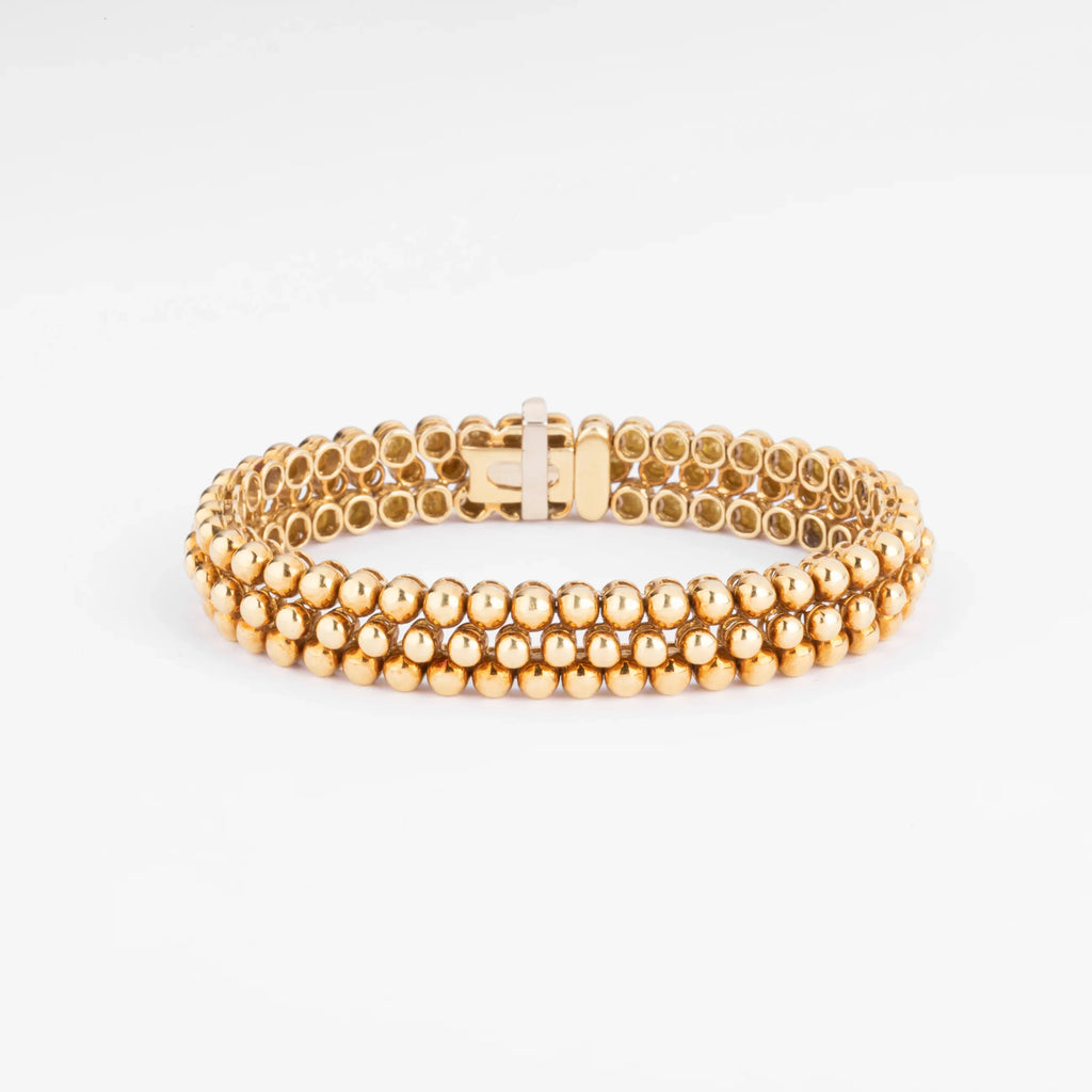 Bracelet or jaune 18k signé et numéroté de la maison Boucheron collection Grains de Raisin