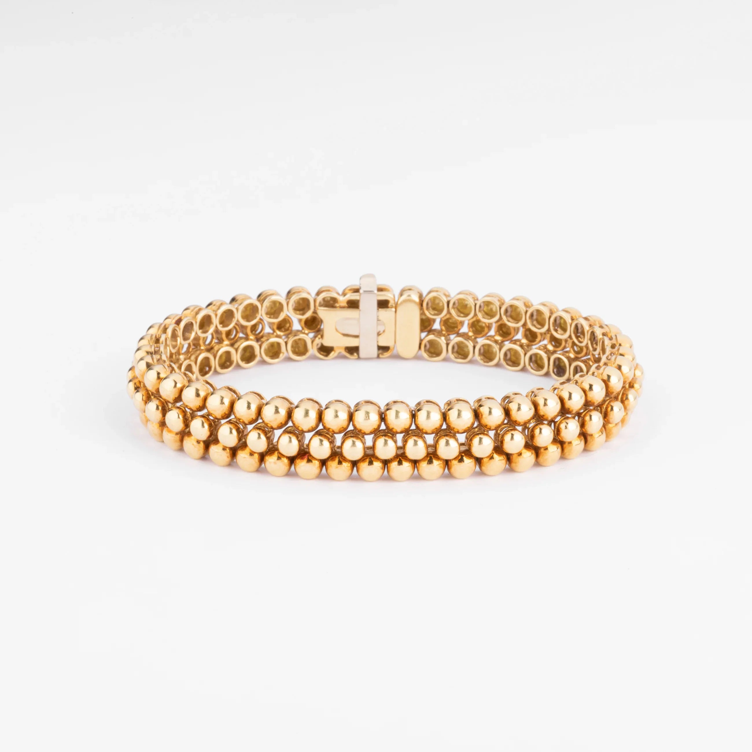 Bracelet or jaune 18k signé et numéroté de la maison Boucheron collection Grains de Raisin