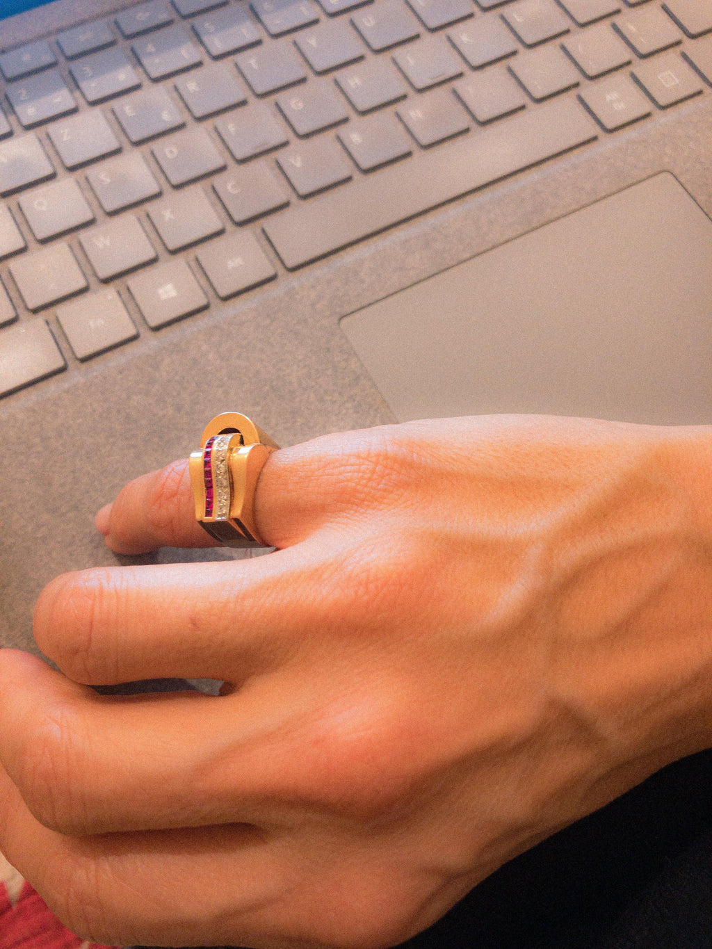 Rose gold tank ring with synthetic diamonds and rubies