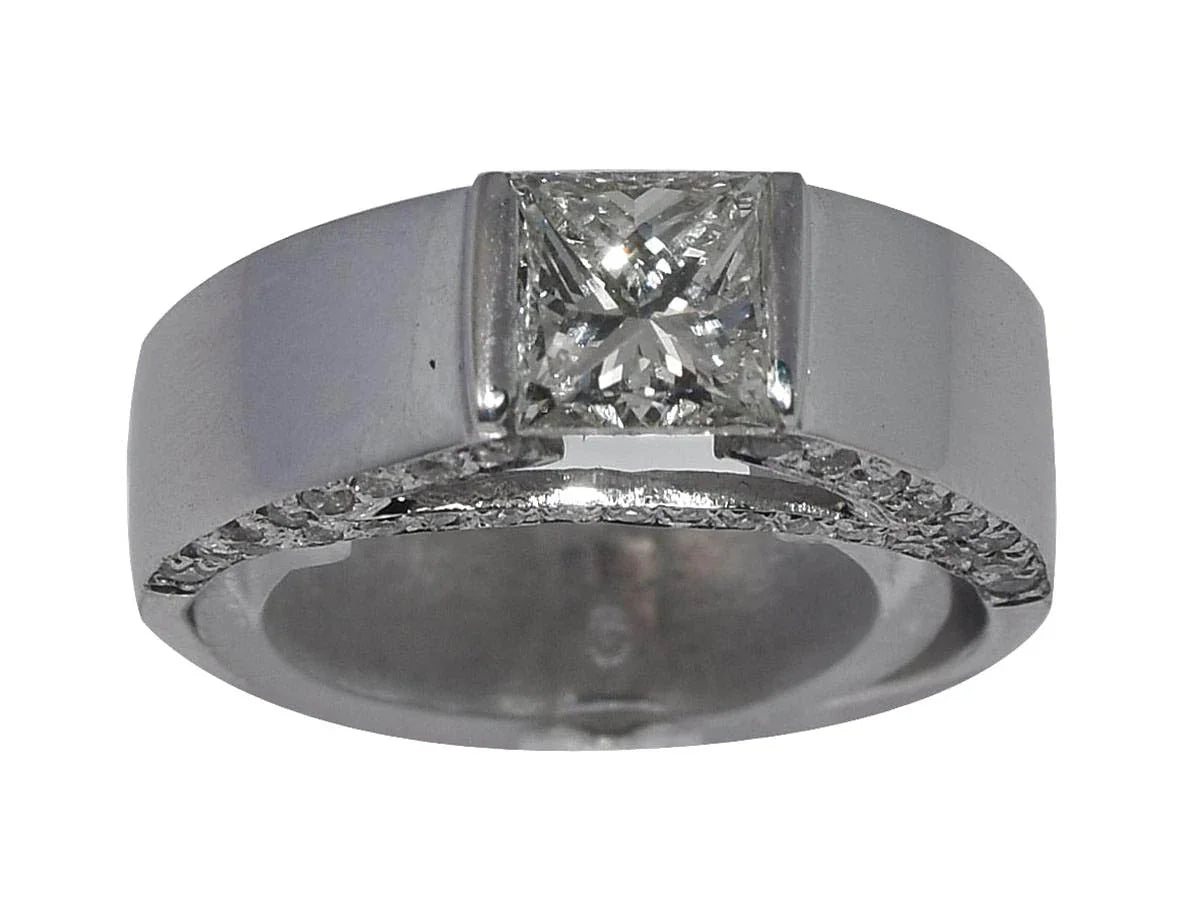 White gold solitaire ring with a princess-cut diamond