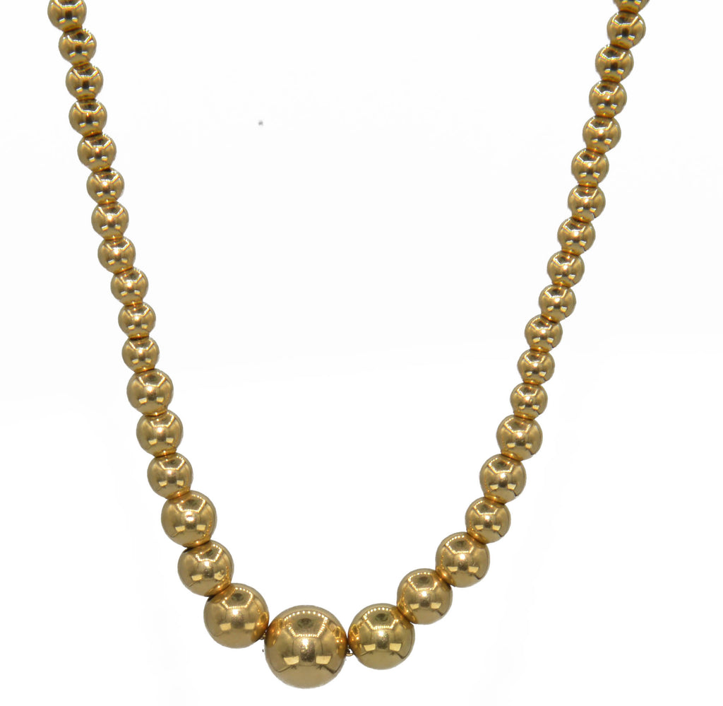 Marseille necklace adorned with gold beads