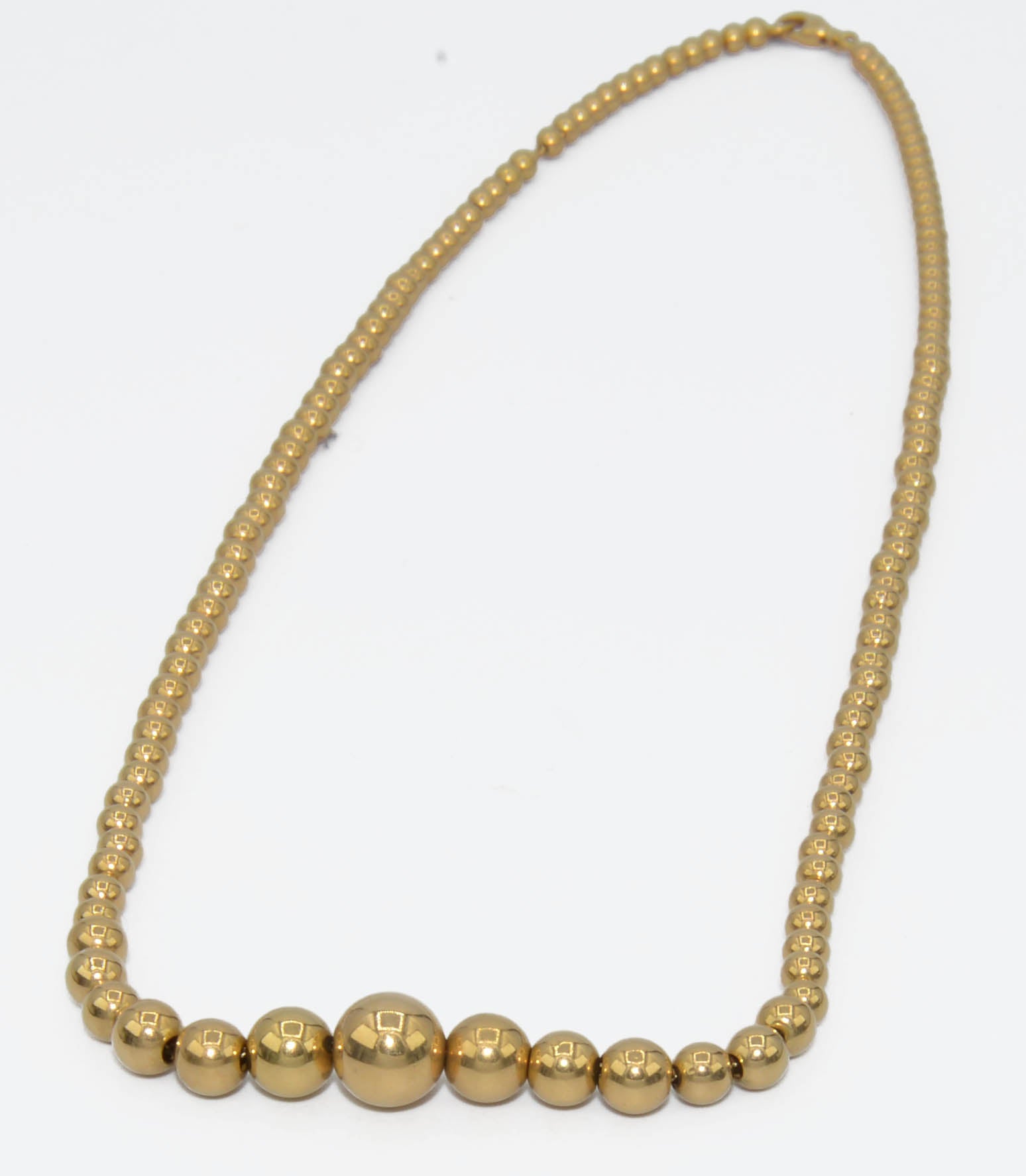 Marseille necklace adorned with gold beads