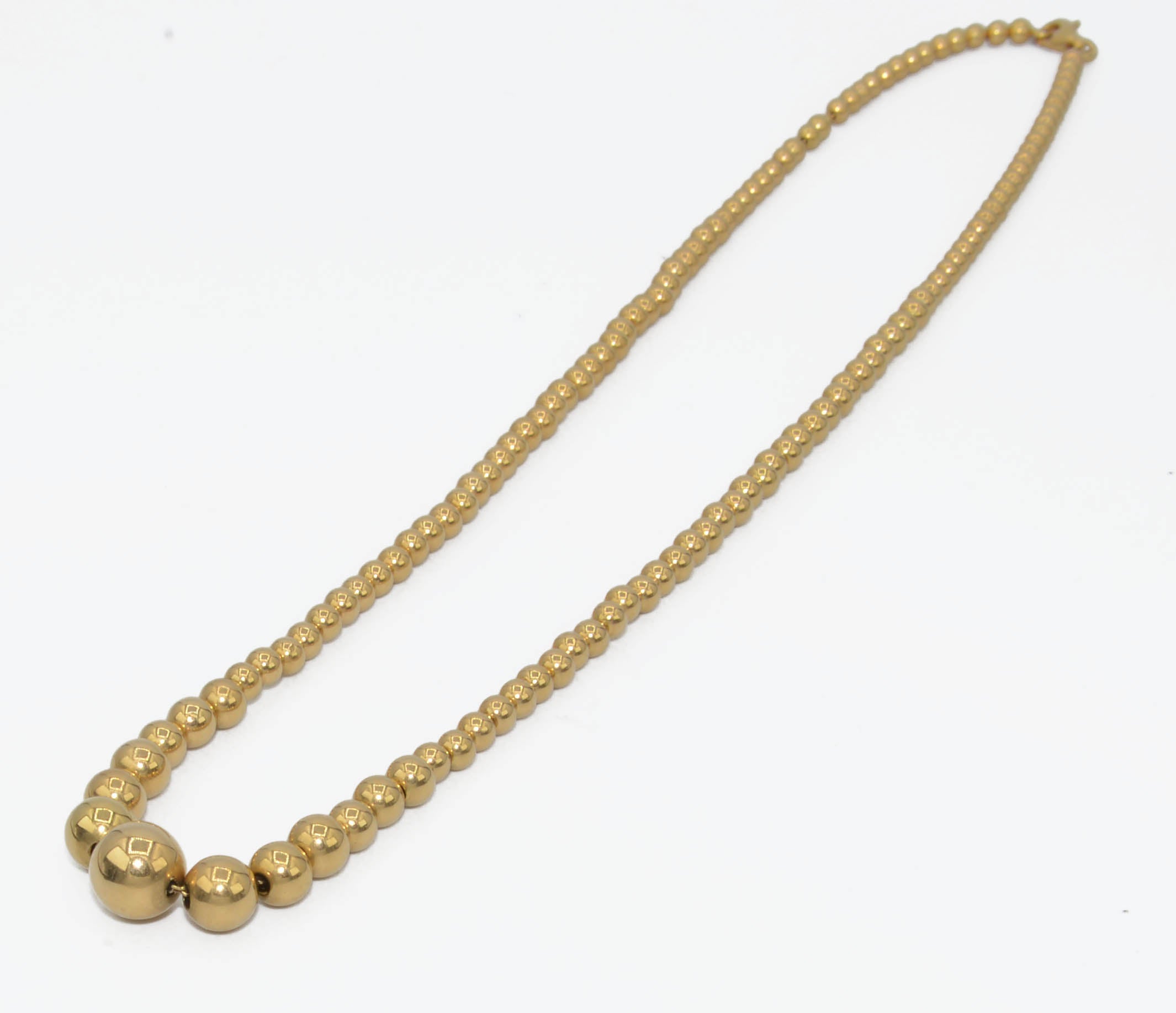 Marseille necklace adorned with gold beads