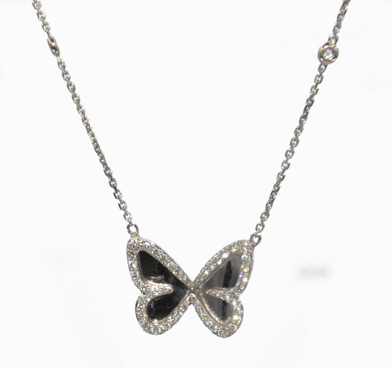White gold diamond pendant with a butterfly pendant