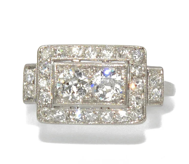 Platinum ring with a rectangular-cut diamond